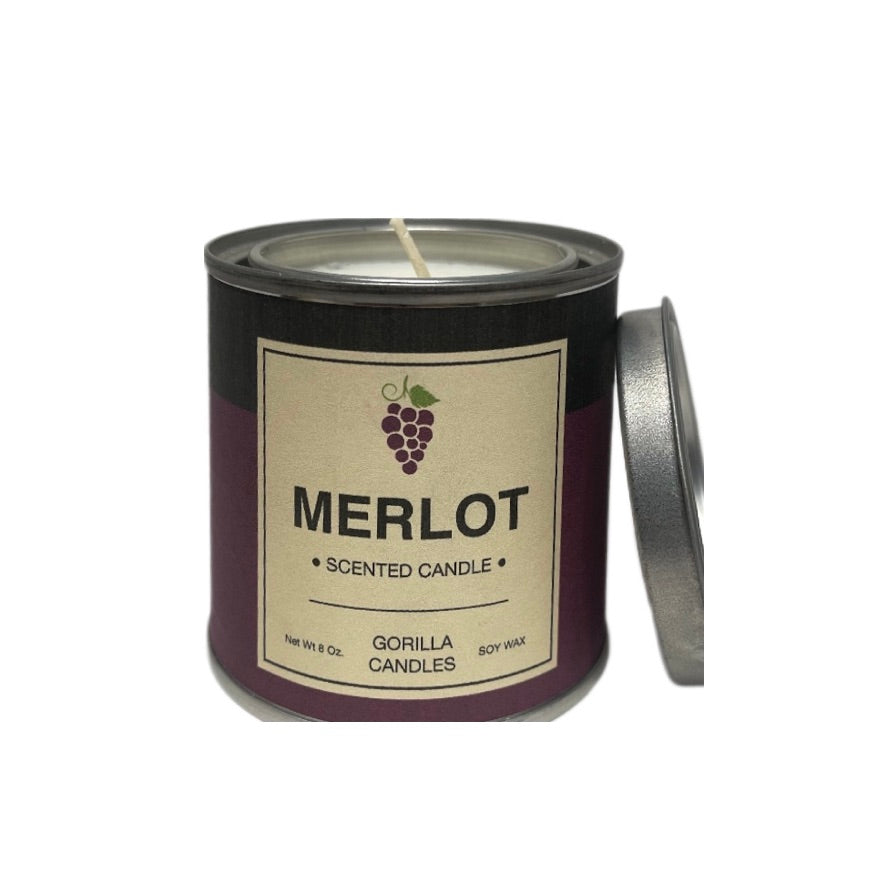 A bottle of Merlot red wine with a glass, showcasing its deep ruby color and elegant label.