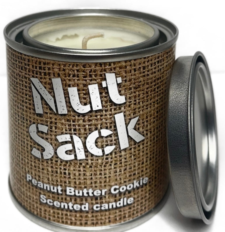 A stylish bottle of Nut Sack fragrance showcasing its unique design and adventurous spirit.