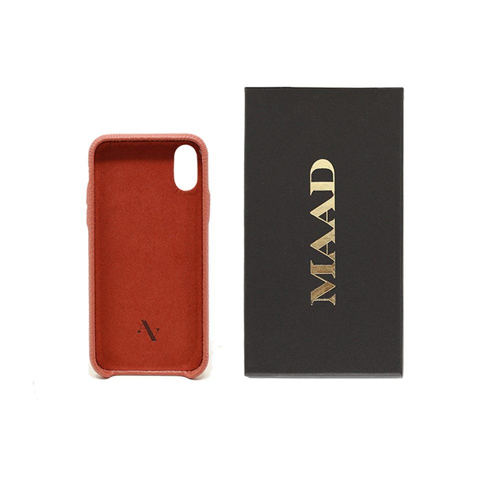 Terracotta pebble leather iPhone X/XS case with a minimalist design, showcasing personalization options and earthy tones.