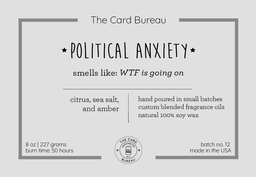 A hand-poured Political Anxiety Candle in a glass jar, featuring a citrus, sea salt, and amber scent, with a recyclable tin lid, showcasing its eco-friendly design.