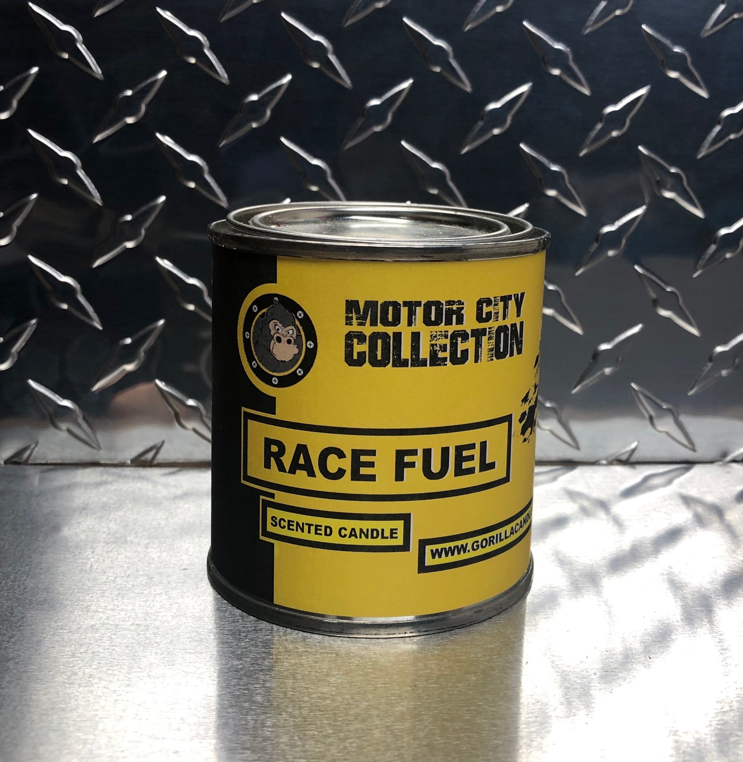 A bottle of Race Fuel showcasing its vibrant label and high octane content, designed for performance vehicles.