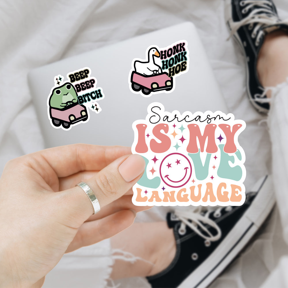 A collection of Sarcasm stickers featuring vibrant designs, showcasing their durable and waterproof vinyl material.