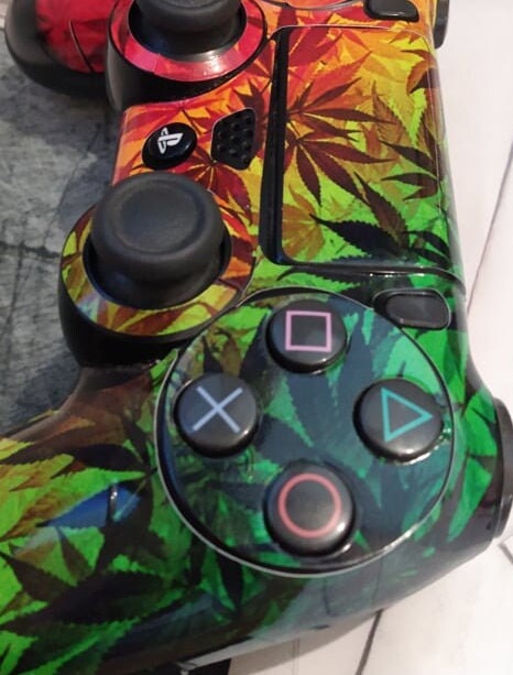 Skins Decal Wrap for PS4 Controller featuring Japanese Rising Sun design, showcasing vibrant colors and premium vinyl material.