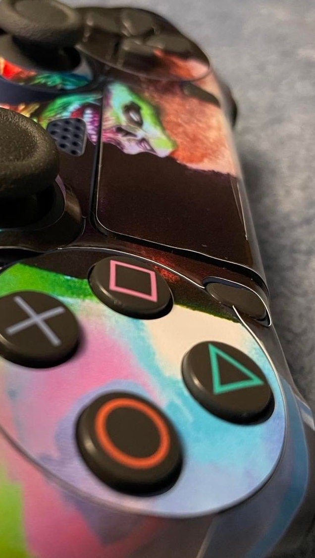 Skins Decal Wrap for PS4 Controller featuring Japanese Rising Sun design, showcasing vibrant colors and premium vinyl material.