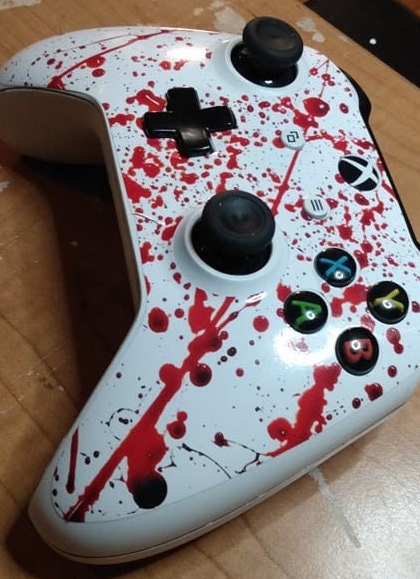 Xbox One S/X Controller Skins Decal Wrap featuring a bold Blood Splatter design, showcasing vibrant colors and intricate details.