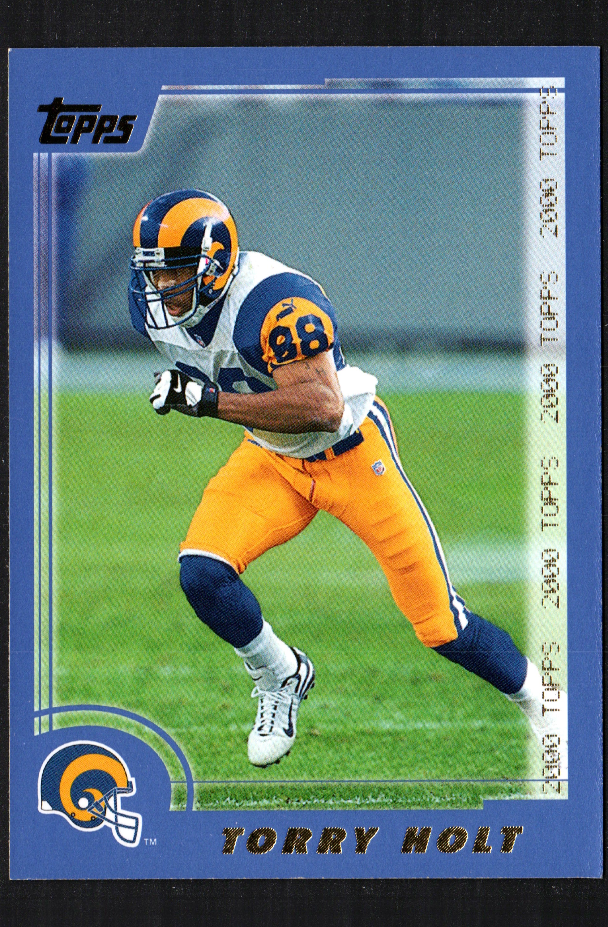 2000 Topps Chrome trading card featuring Torry Holt of the St. Louis Rams, card number 144, showcasing vibrant colors and glossy finish.