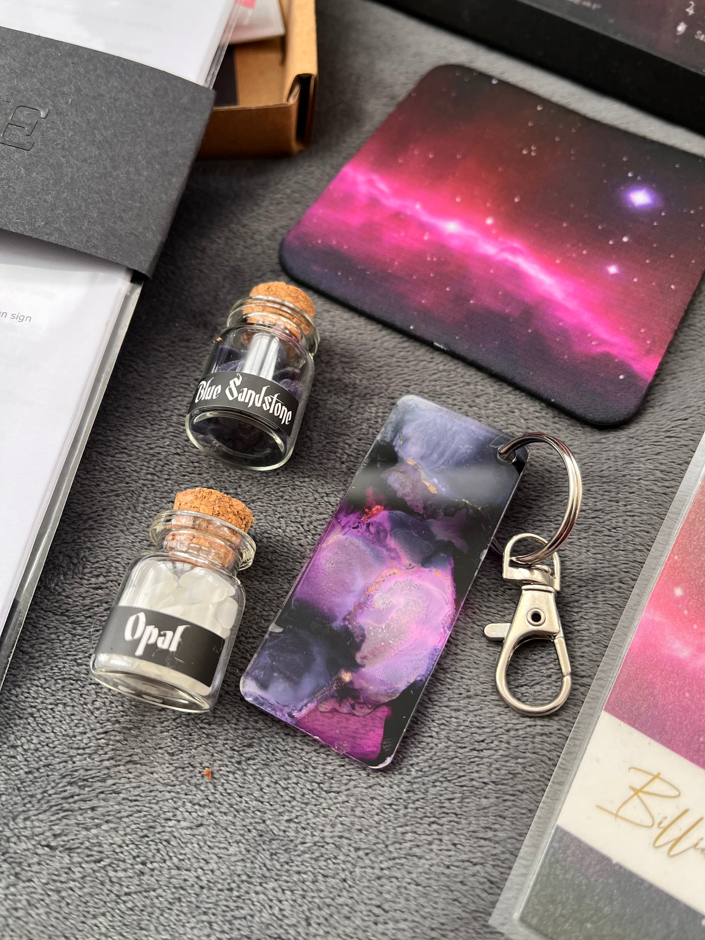 Astrology Birth Chart Gift Set featuring a framed birth chart print, personalized booklet, handmade keyring, coaster, bookmark, and healing crystals.