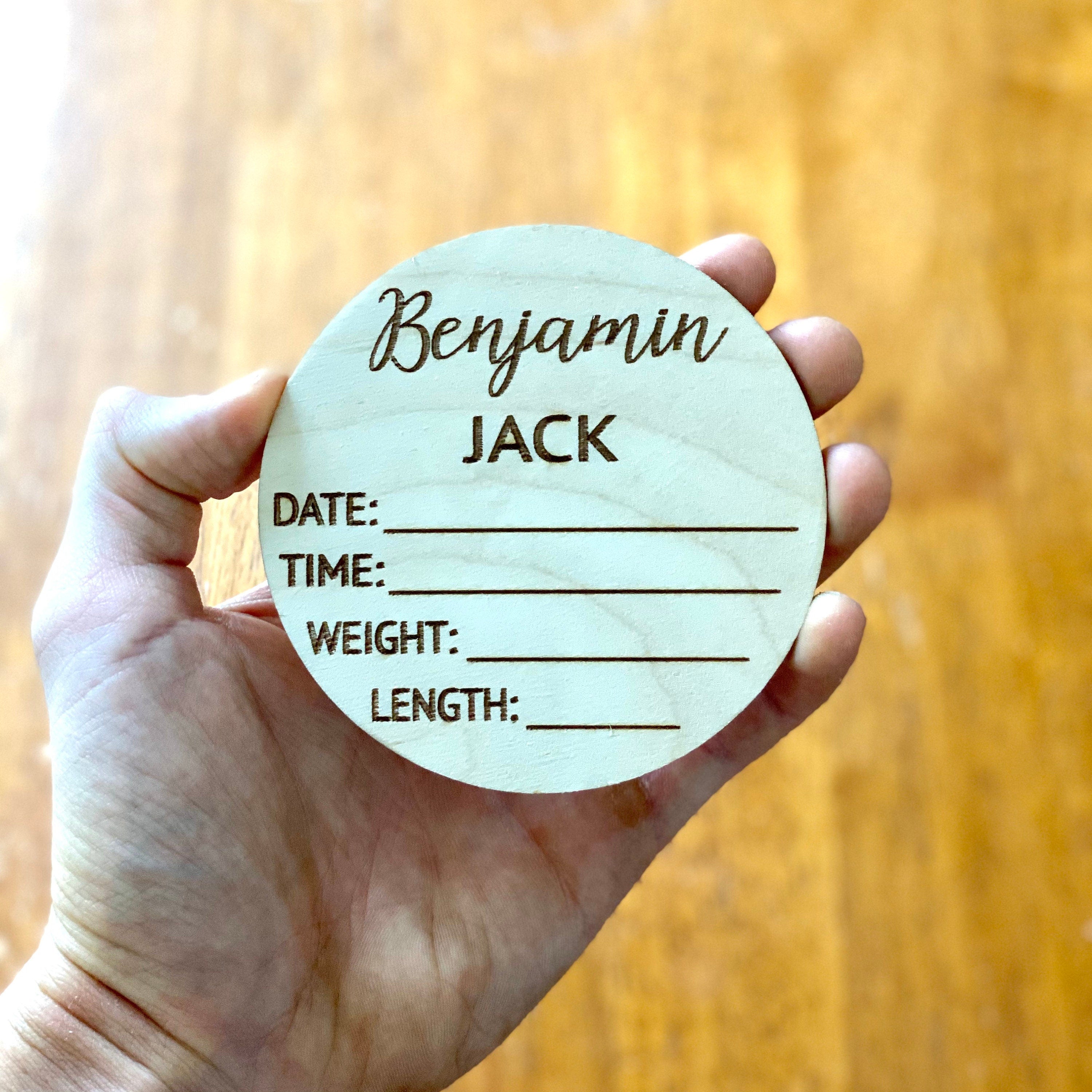 A beautifully crafted birch wood milestone card for documenting baby's birth stats, featuring laser engraving and a smooth finish.