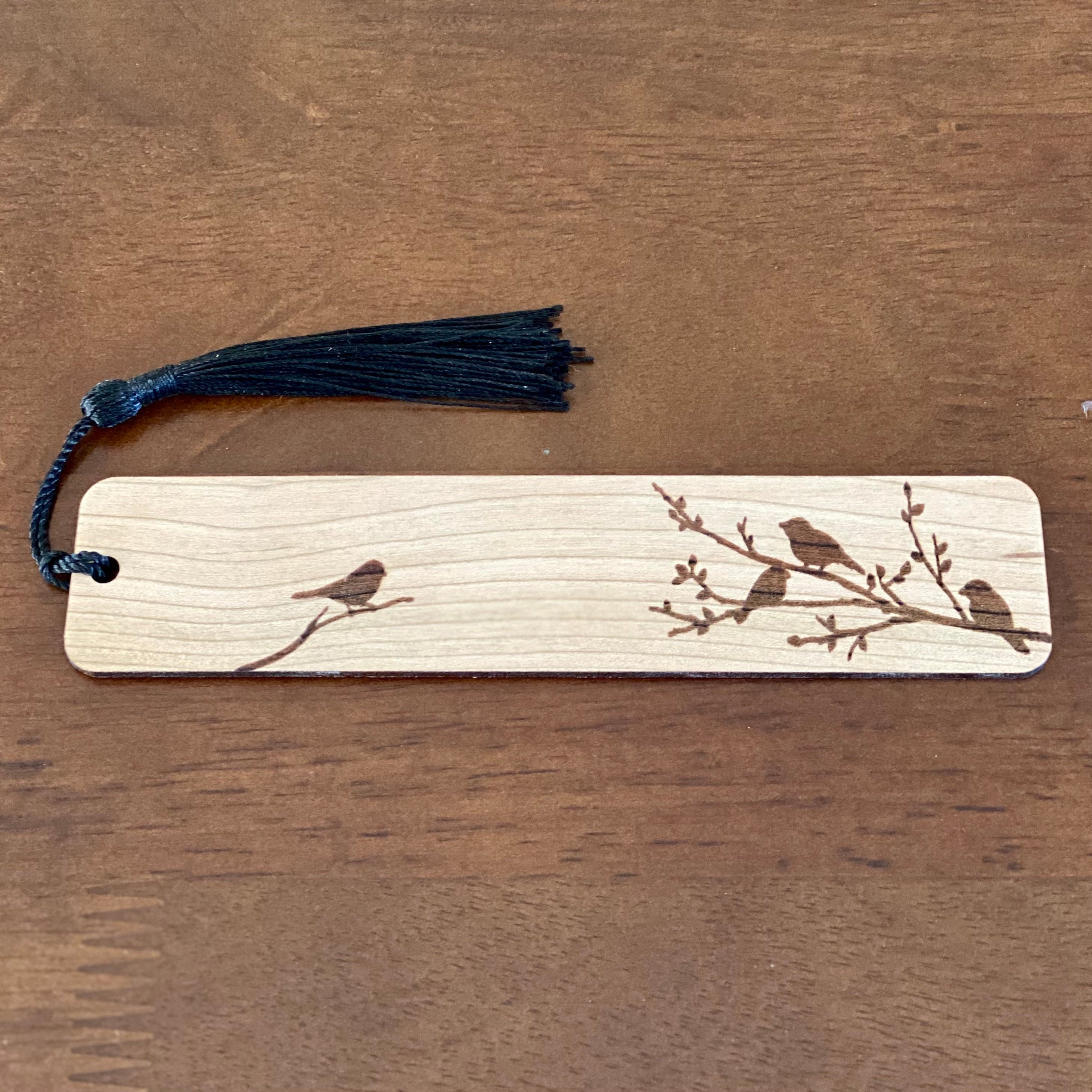 Engraved wood bookmark featuring silhouettes of birds on branches, made from Cherry hardwood with a colorful tassel.