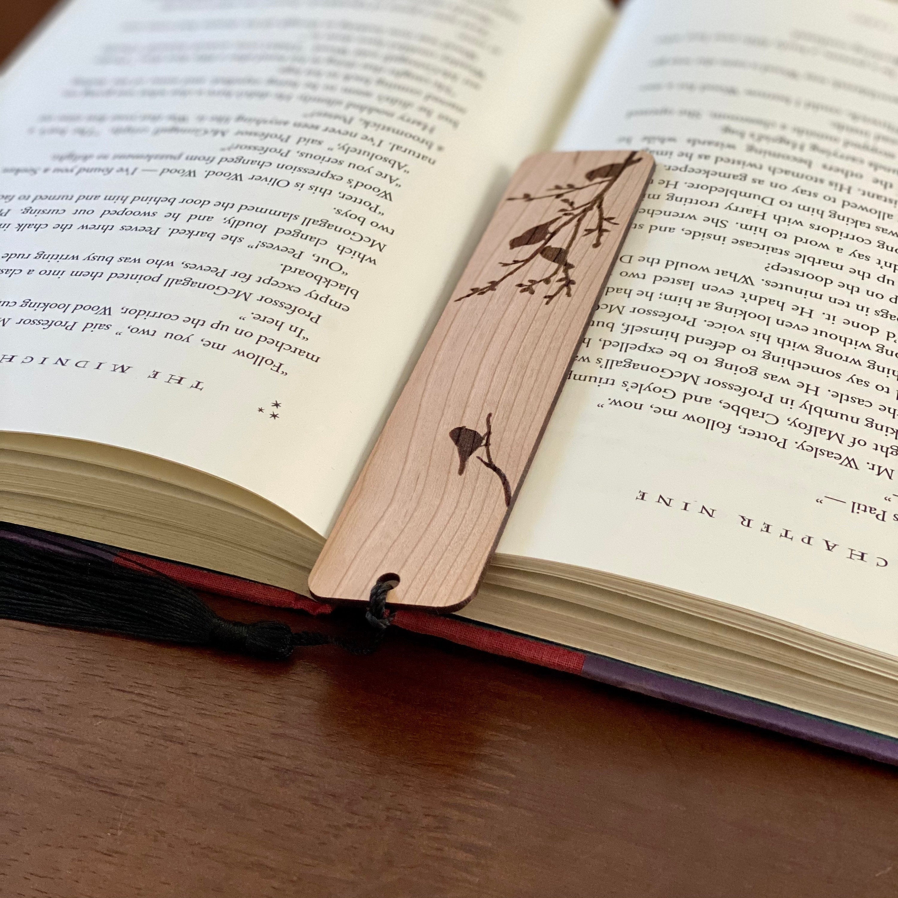 Engraved wood bookmark featuring silhouettes of birds on branches, made from Cherry hardwood with a colorful tassel.