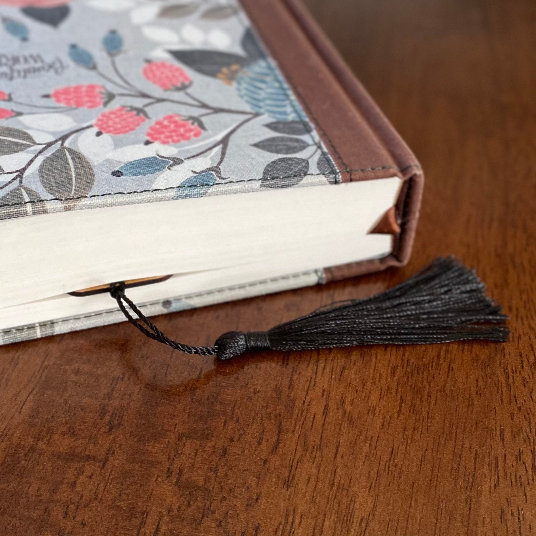 Engraved wood bookmark featuring silhouettes of birds on branches, made from Cherry hardwood with a colorful tassel.