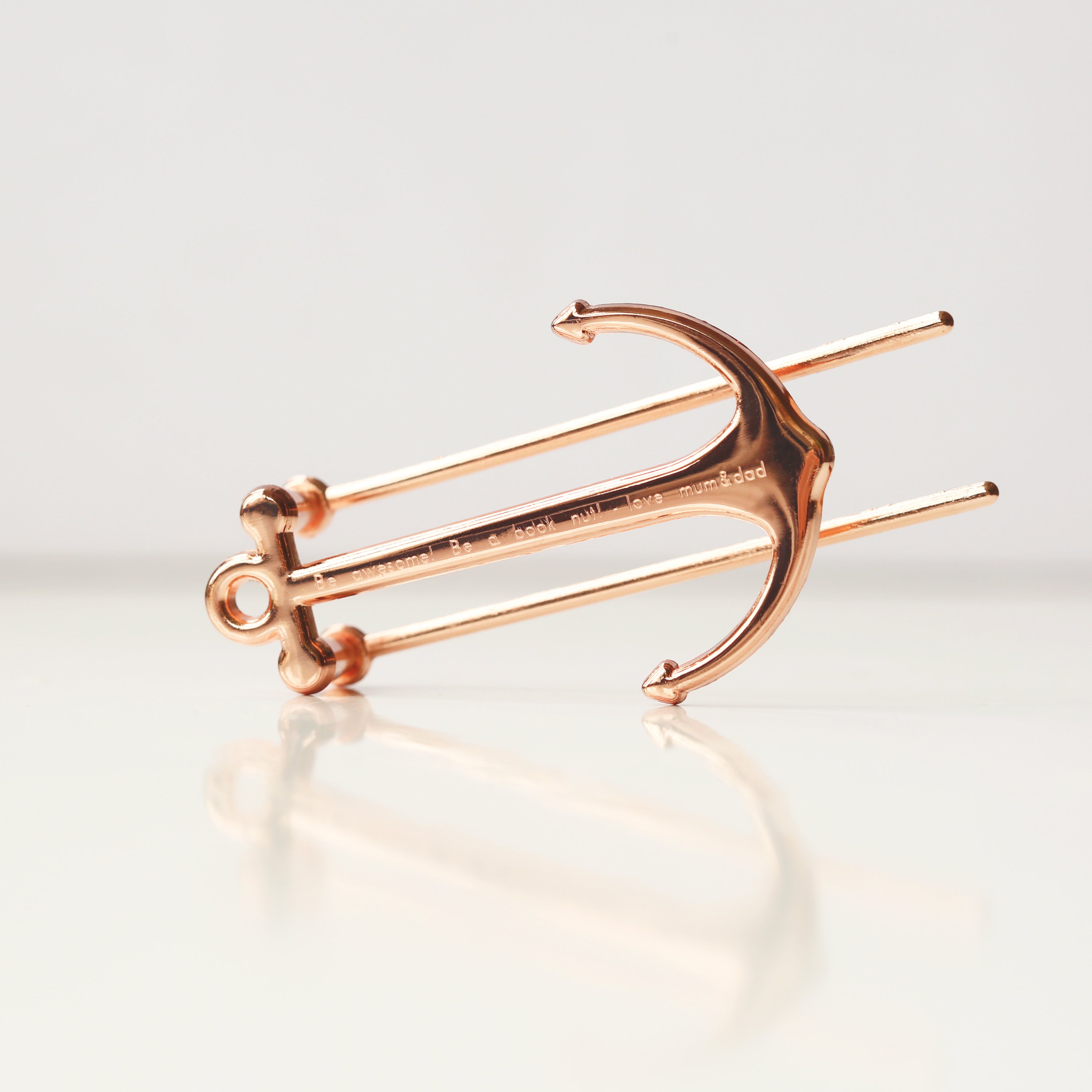 Gold and Rose Gold Book Anchor, elegantly designed to hold books open, featuring personalized engraving options.