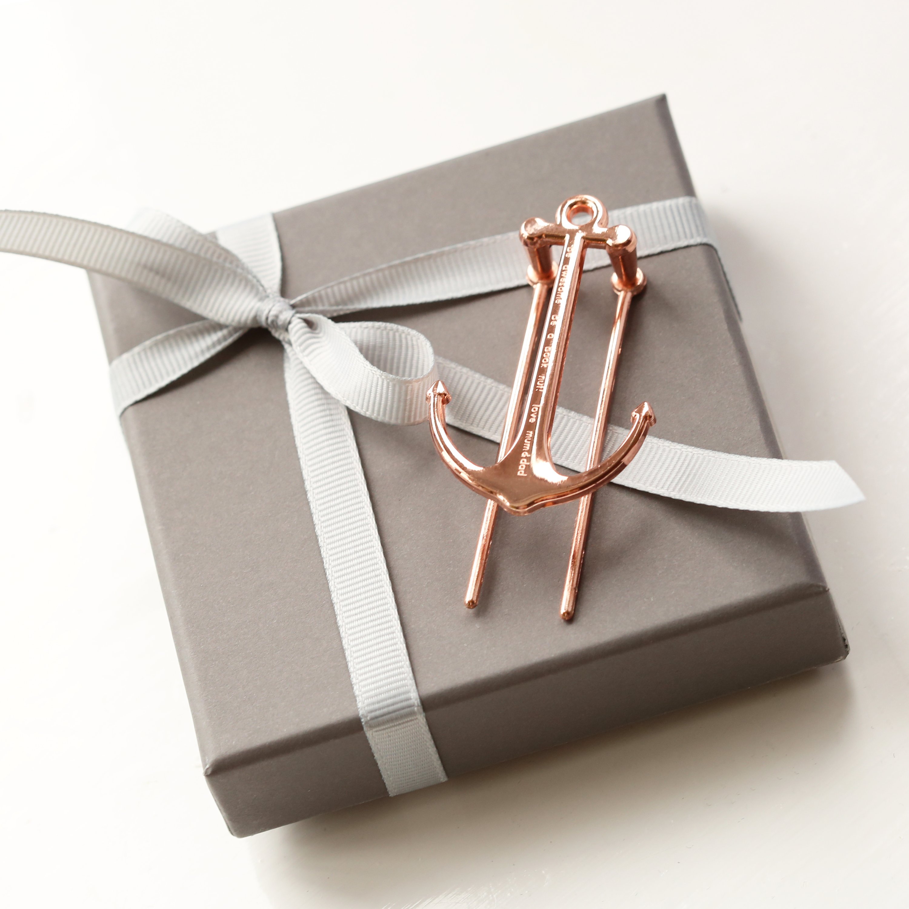 Gold and Rose Gold Book Anchor, elegantly designed to hold books open, featuring personalized engraving options.