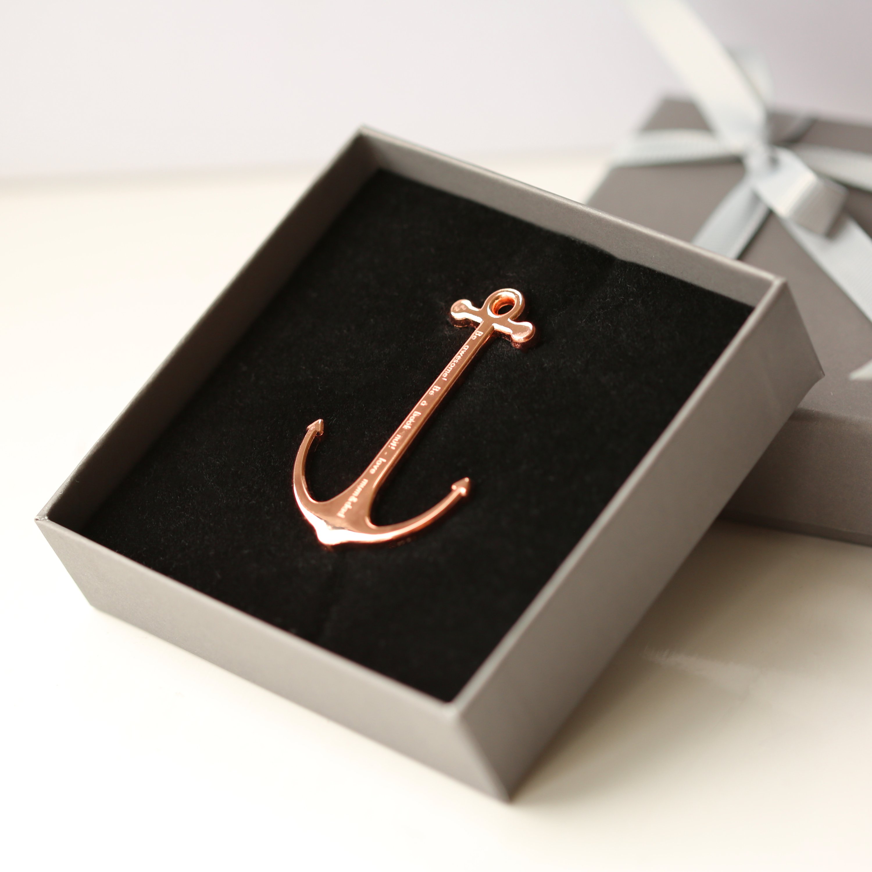 Gold and Rose Gold Book Anchor, elegantly designed to hold books open, featuring personalized engraving options.