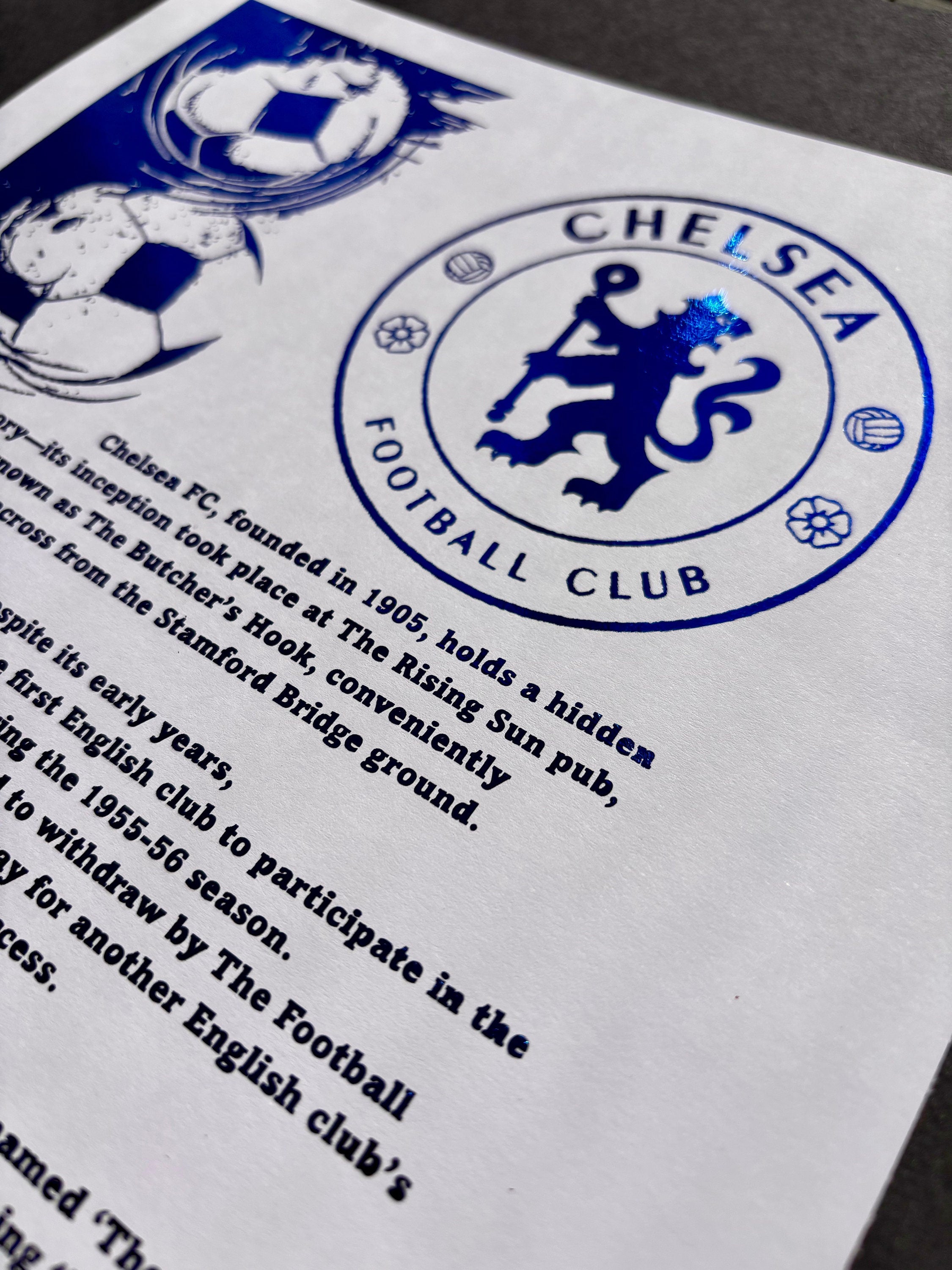 A stunning A4 foil print featuring the Chelsea FC logo embossed in radiant blue foil, showcasing the club's legacy.