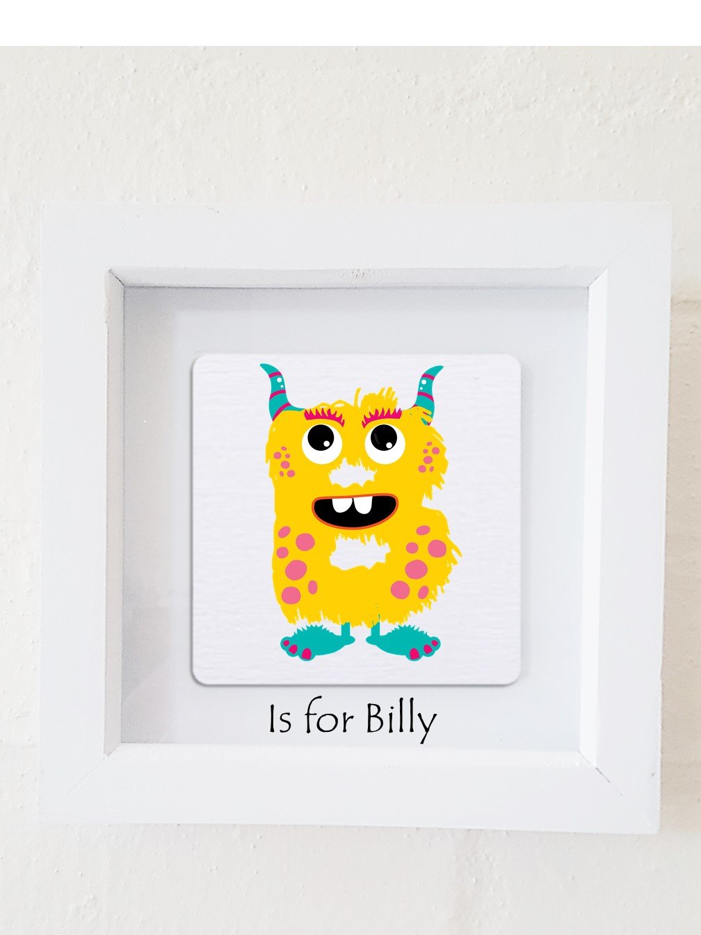 A colorful framed plaque featuring a monster design, personalized with a child's initial and name, perfect for children's bedroom decor.