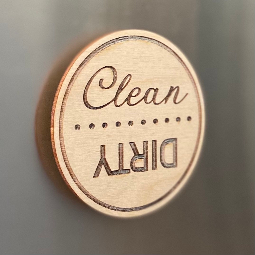 Engraved wood disc magnet for dishwasher status, featuring clean and dirty indicators.