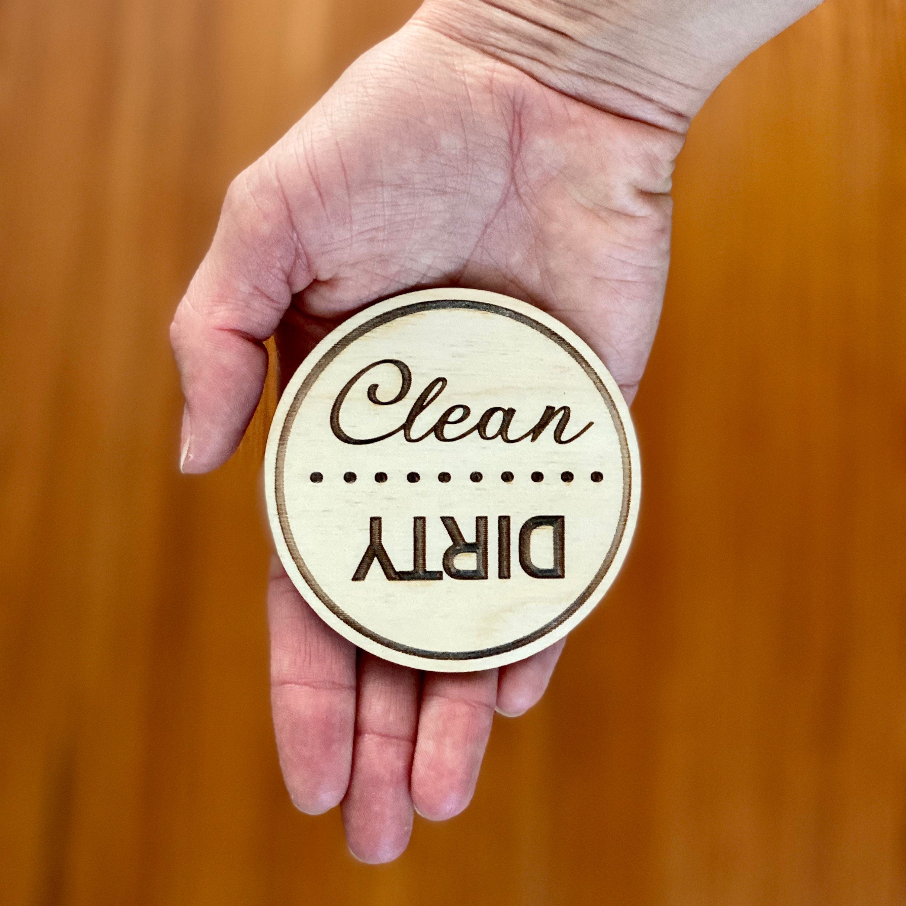 Engraved wood disc magnet for dishwasher status, featuring clean and dirty indicators.