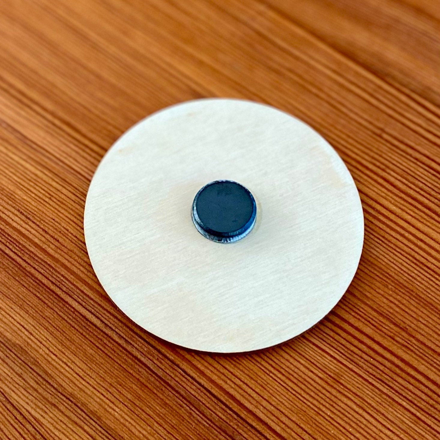 Engraved wood disc magnet for dishwasher status, featuring clean and dirty indicators.