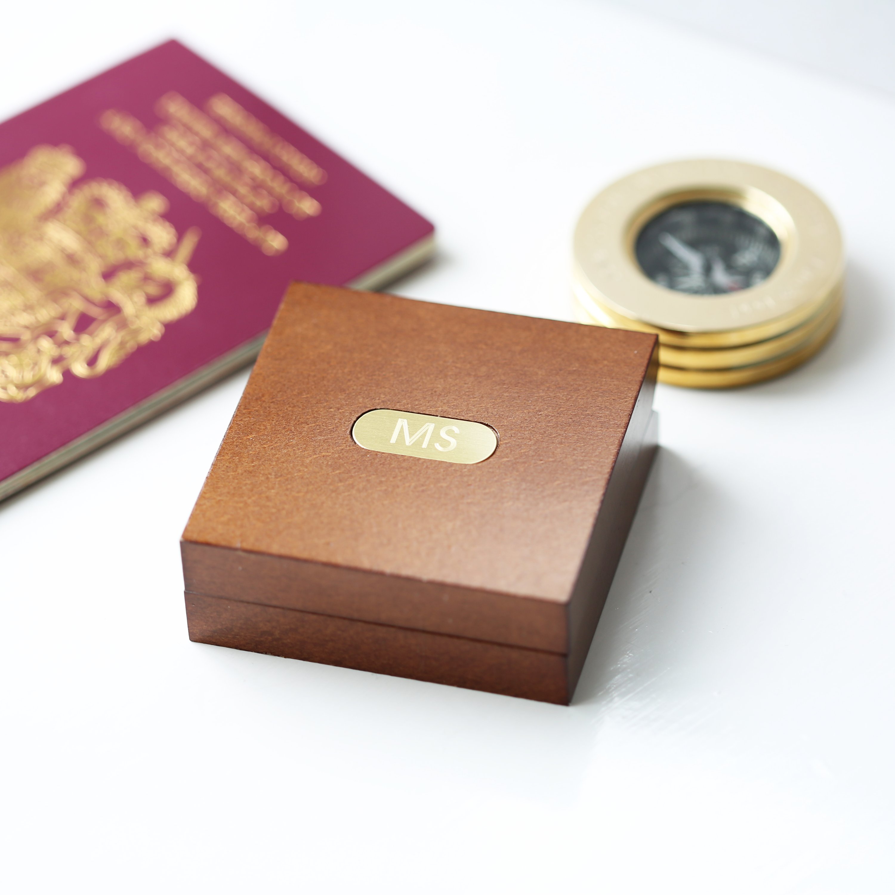 Personalised brass compass displayed in a fine mahogany timber box, showcasing its elegant design and engraving.