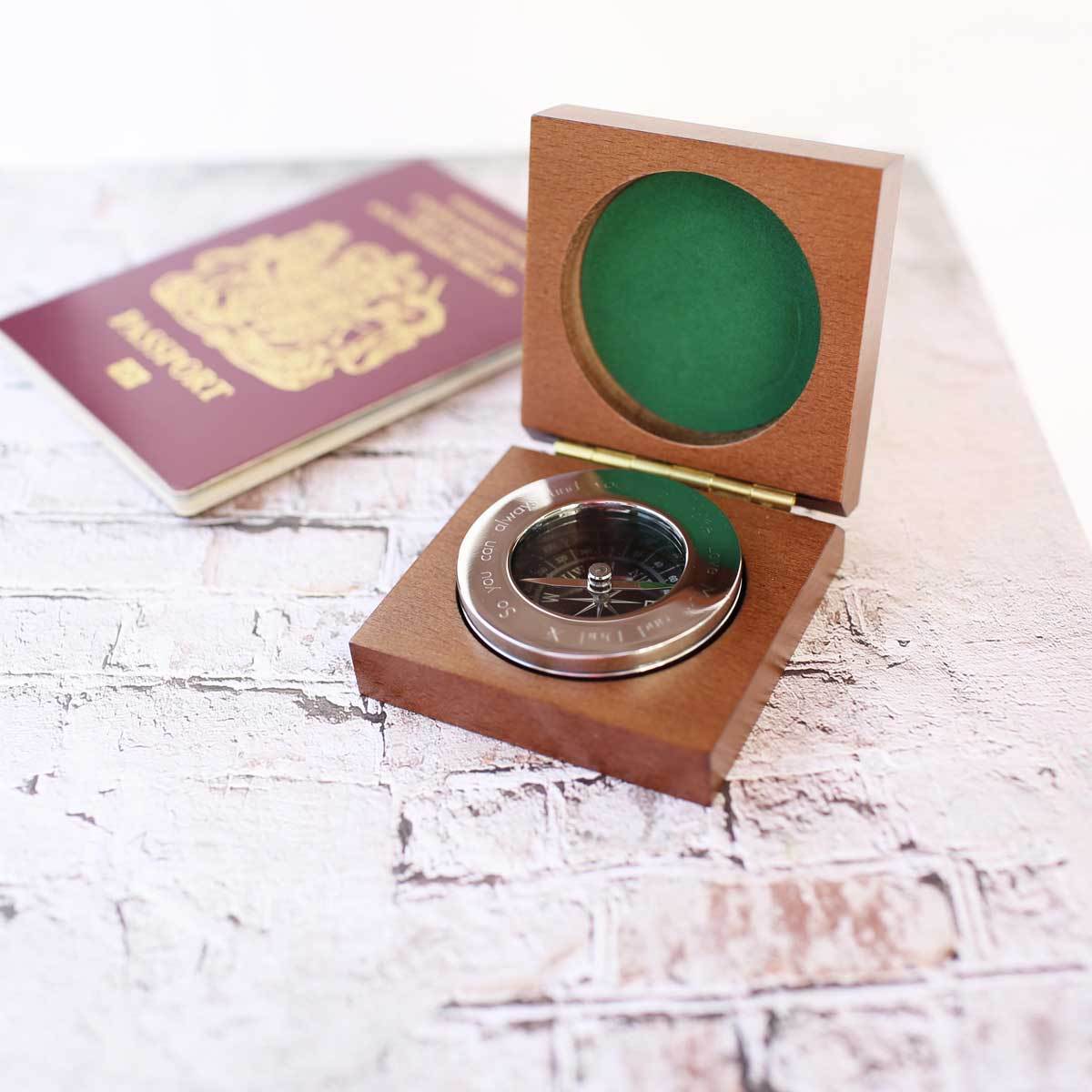 Personalised brass compass displayed in a fine mahogany timber box, showcasing its elegant design and engraving.