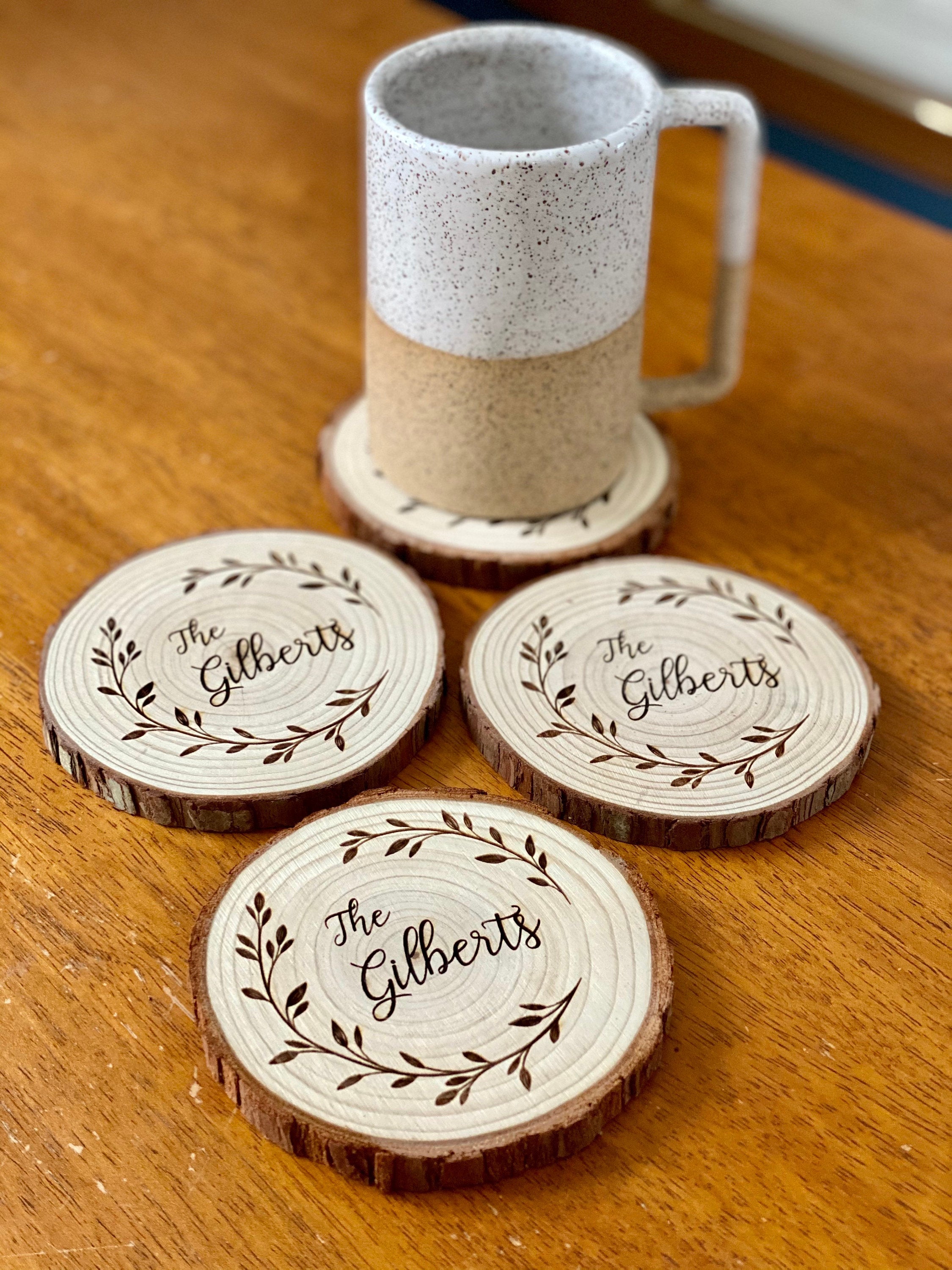 Custom family name engraved wood coasters set made from Californian Pine, showcasing rustic design and laser engraving.