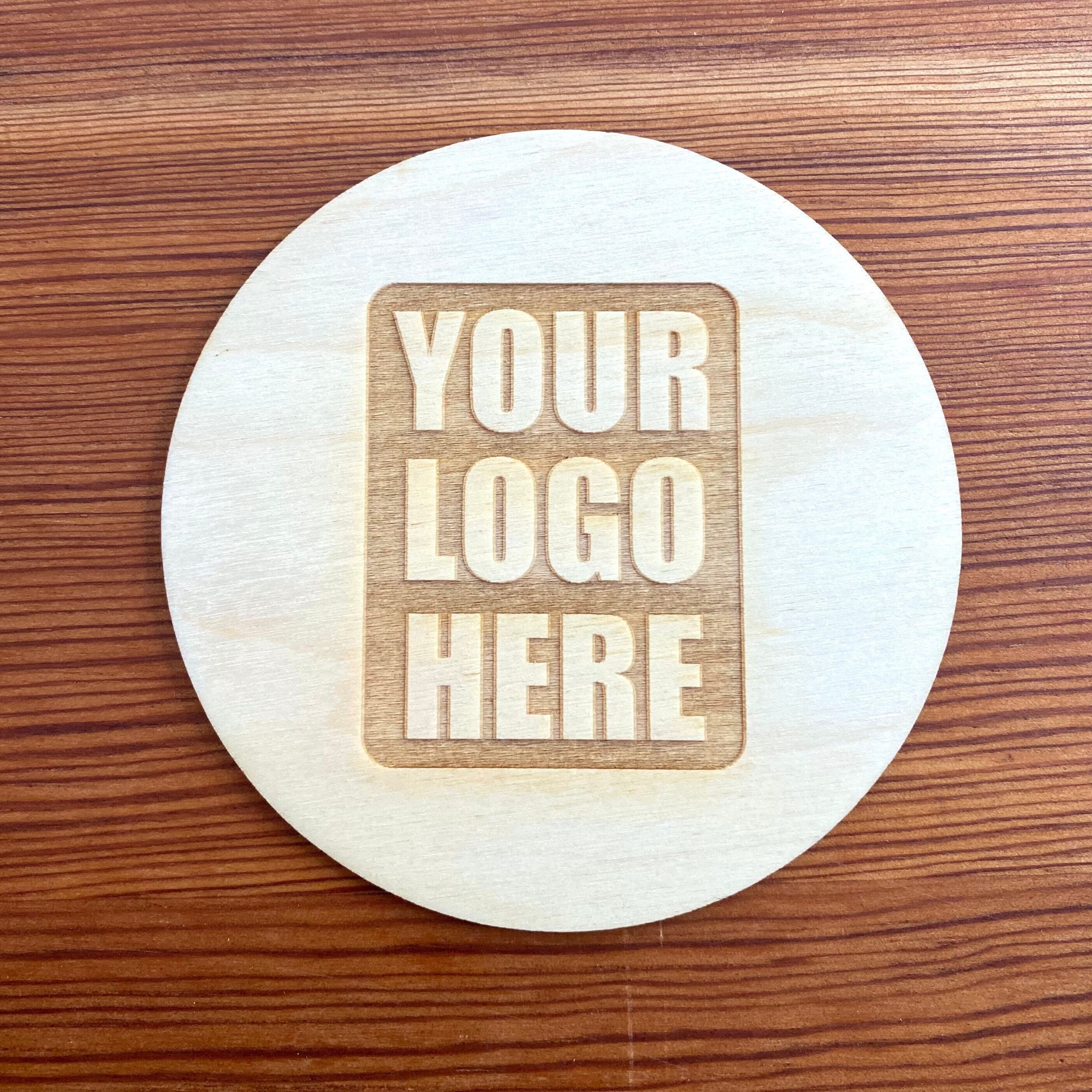 Set of custom logo wood coasters made from Baltic Birch, featuring laser engraved logos, perfect for corporate gifts and office use.