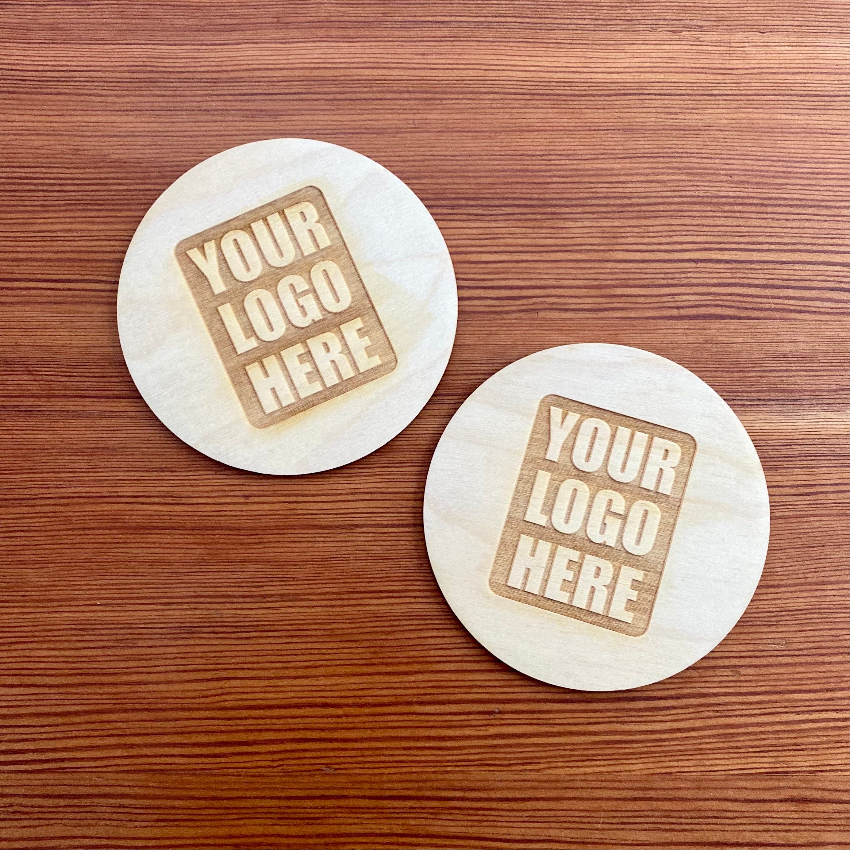 Set of custom logo wood coasters made from Baltic Birch, featuring laser engraved logos, perfect for corporate gifts and office use.