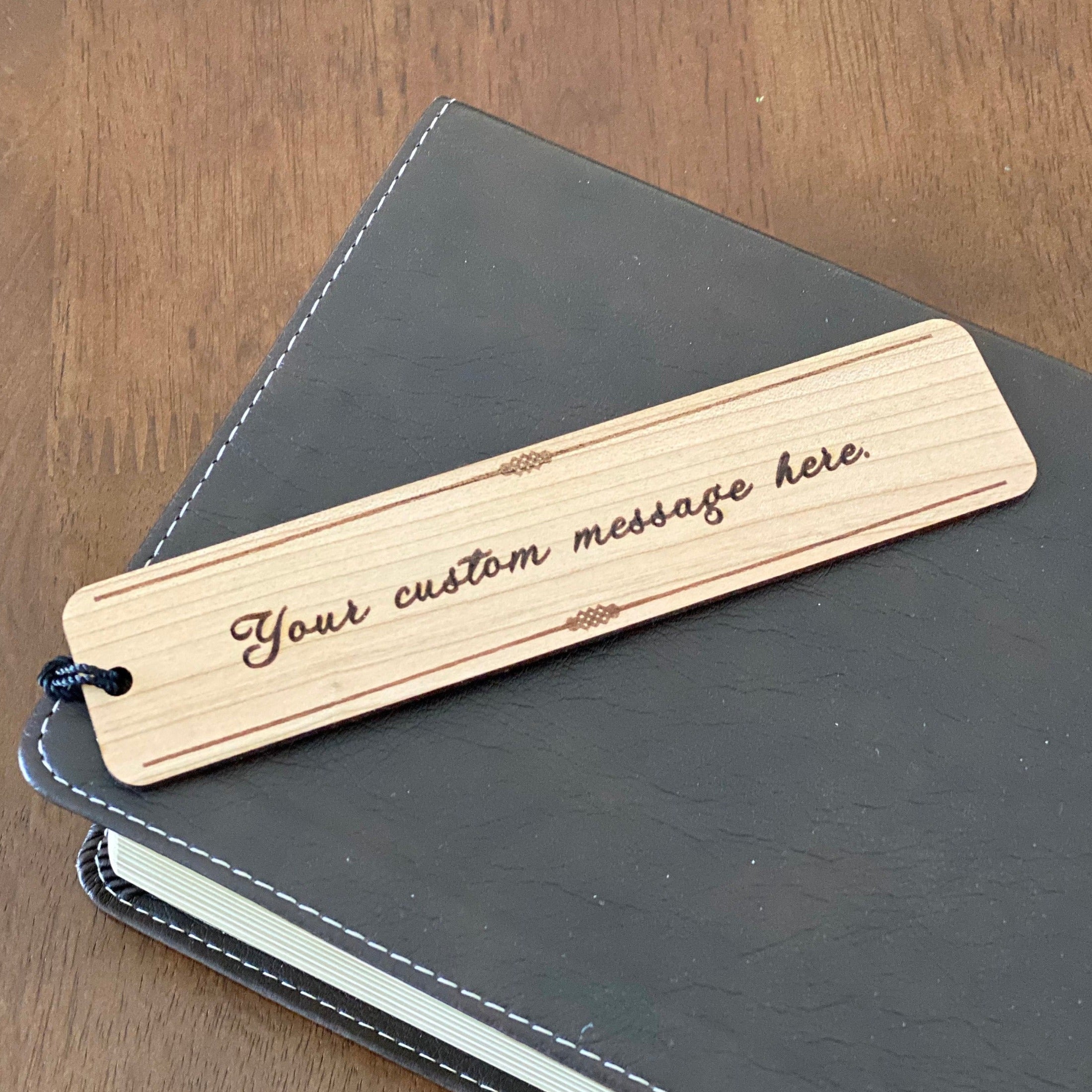 Custom Message Engraved Wood Bookmark made of Cherry hardwood with a tassel, showcasing elegant design and personalization options.