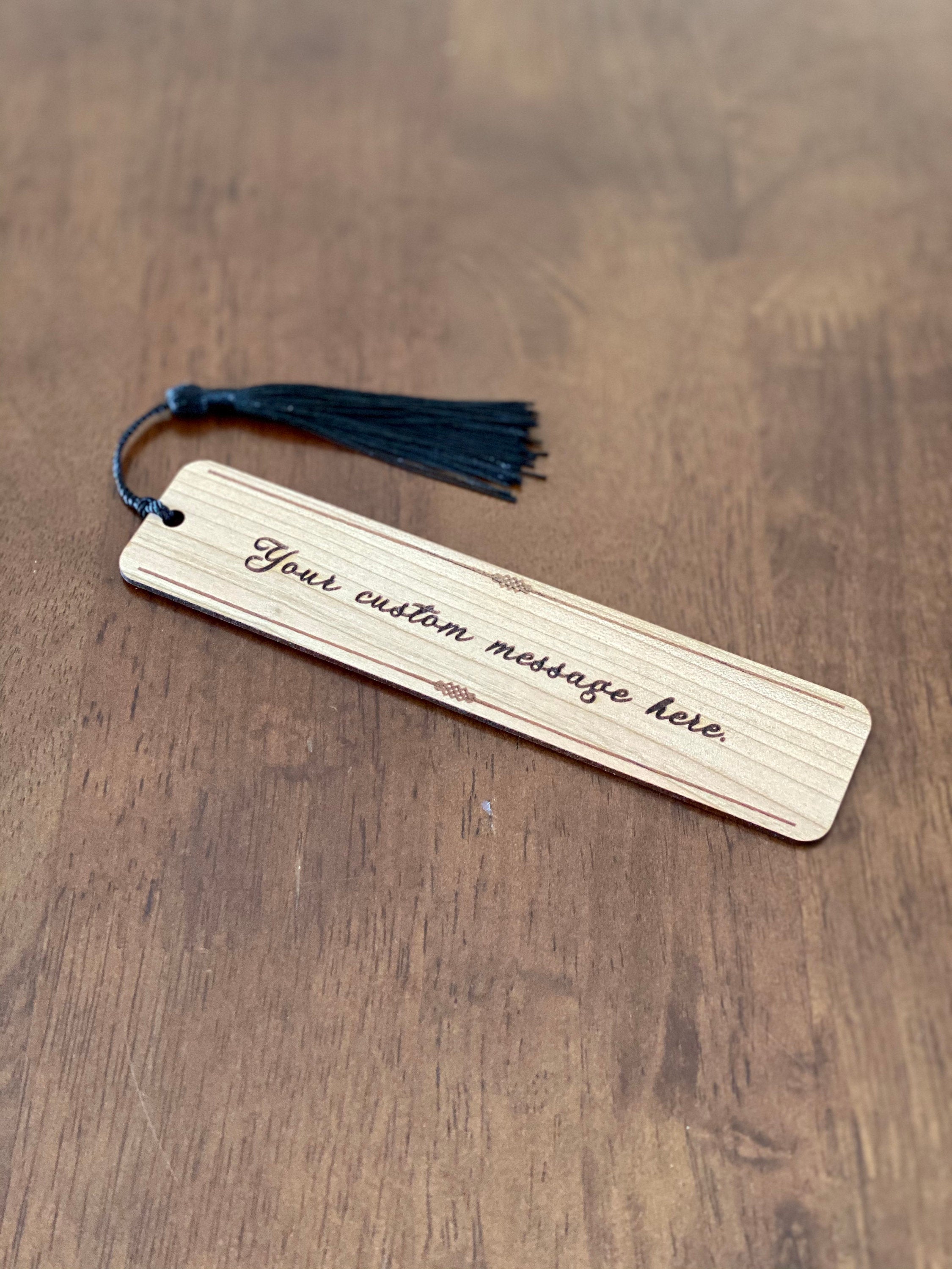 Custom Message Engraved Wood Bookmark made of Cherry hardwood with a tassel, showcasing elegant design and personalization options.