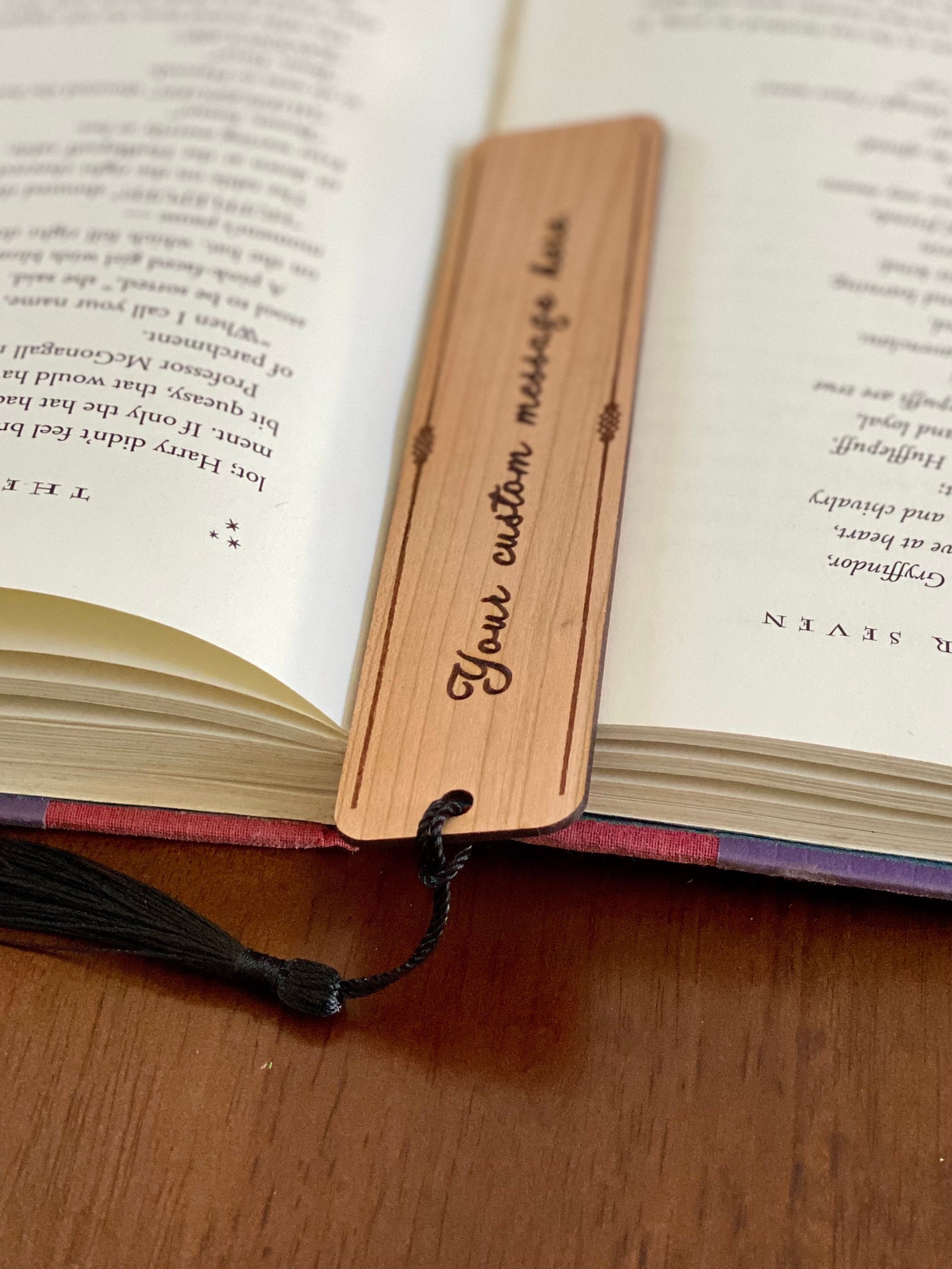 Custom Message Engraved Wood Bookmark made of Cherry hardwood with a tassel, showcasing elegant design and personalization options.