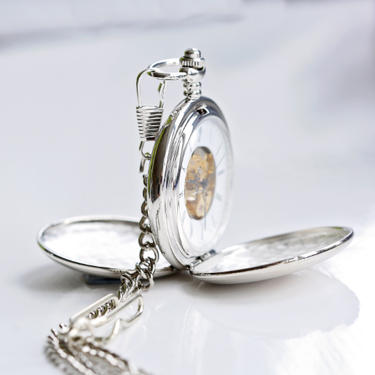 A beautifully crafted Dual Opening Pocket Watch showcasing its skeleton view and personalised engraving options.