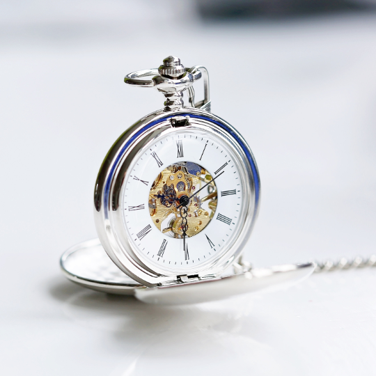 A beautifully crafted Dual Opening Pocket Watch showcasing its skeleton view and personalised engraving options.