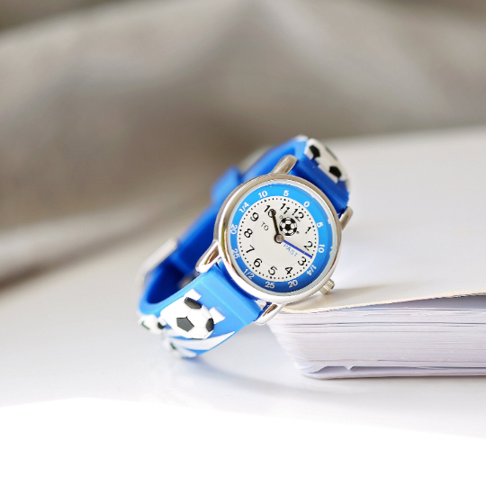 Engraved Kids 3D Football Watch in blue with rotating football second hand and personalised engraving.