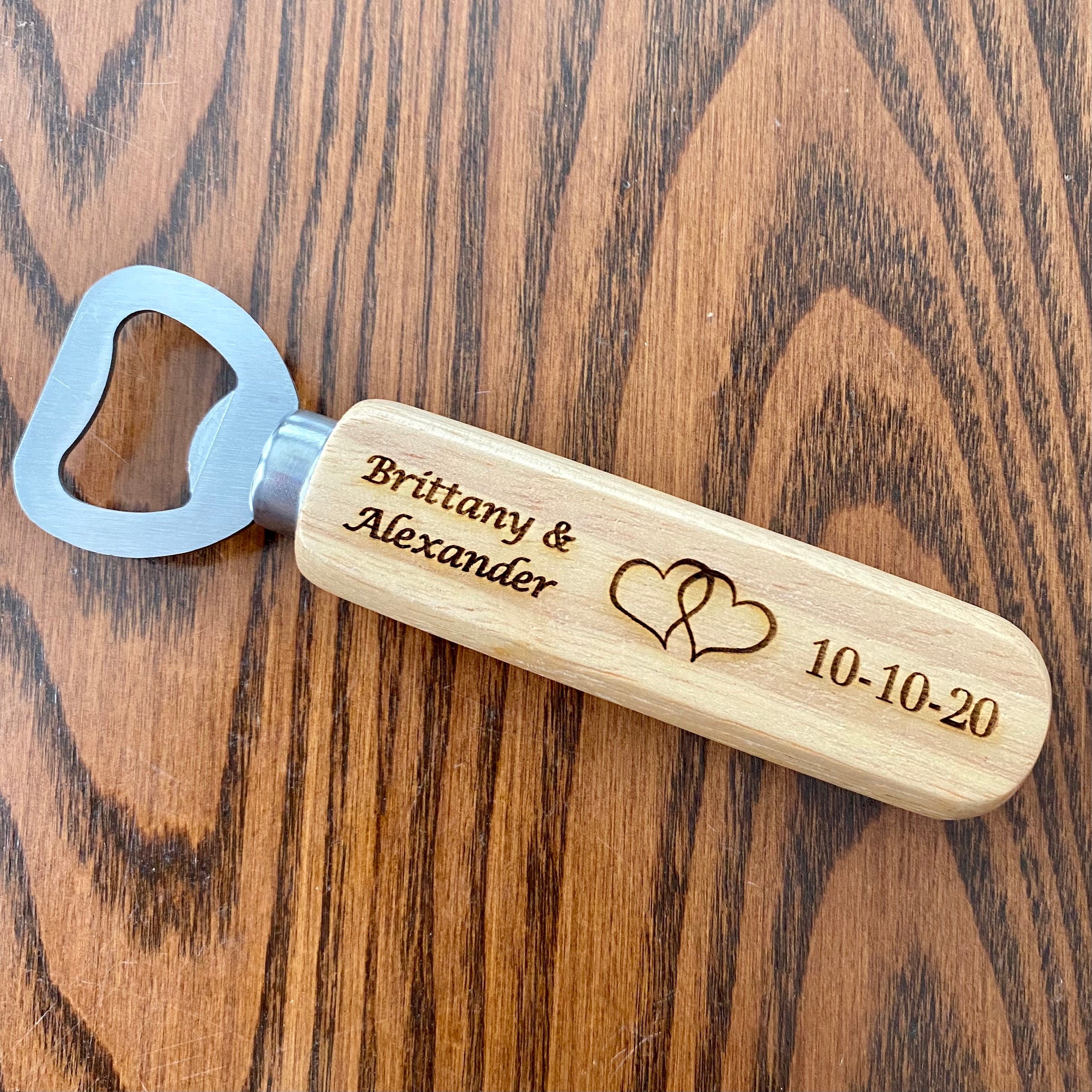 Personalized engraved wood bottle opener with heart design, perfect for weddings.