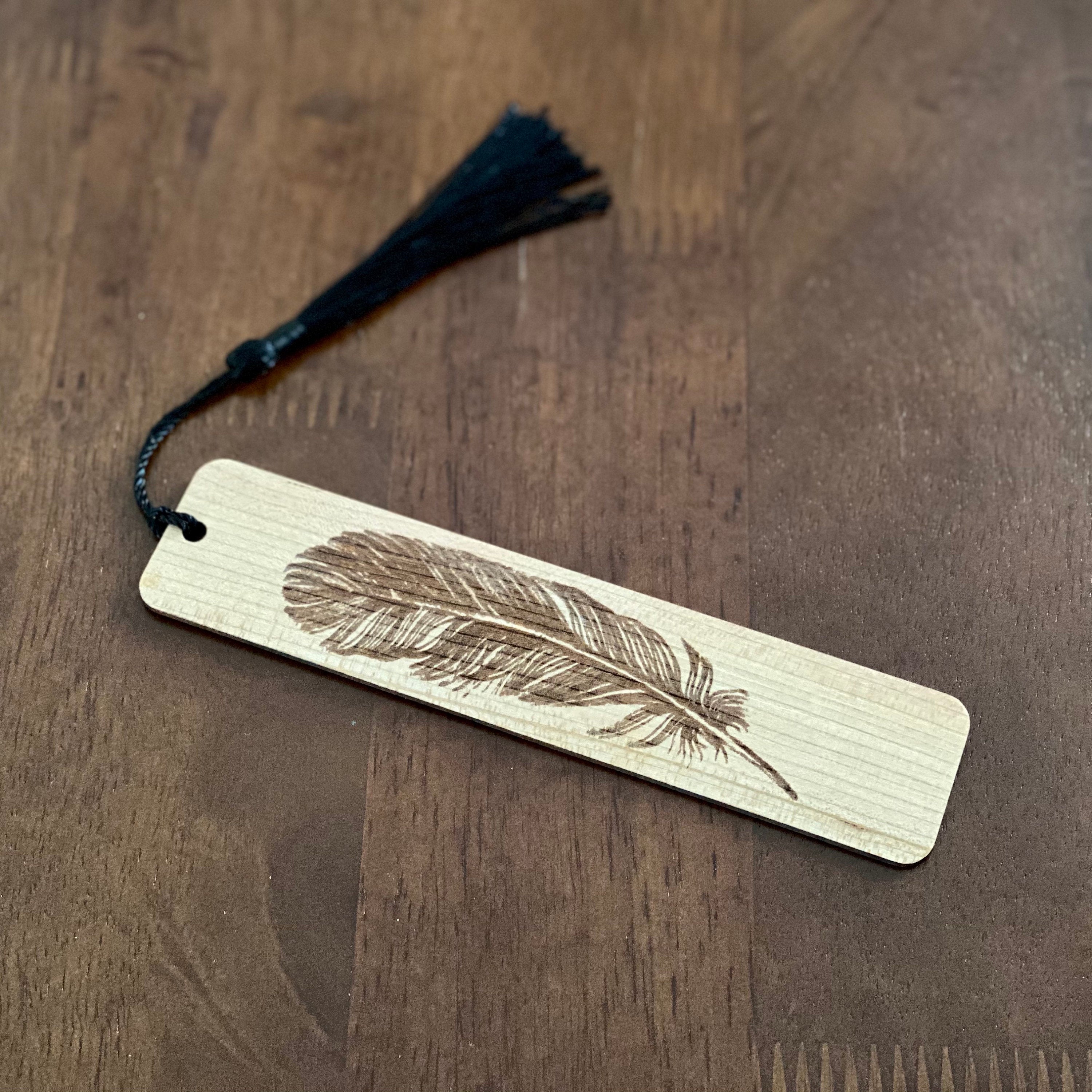 Feather Engraved Wood Bookmark made of Cherry hardwood with a detailed feather illustration and colorful terylene tassel.