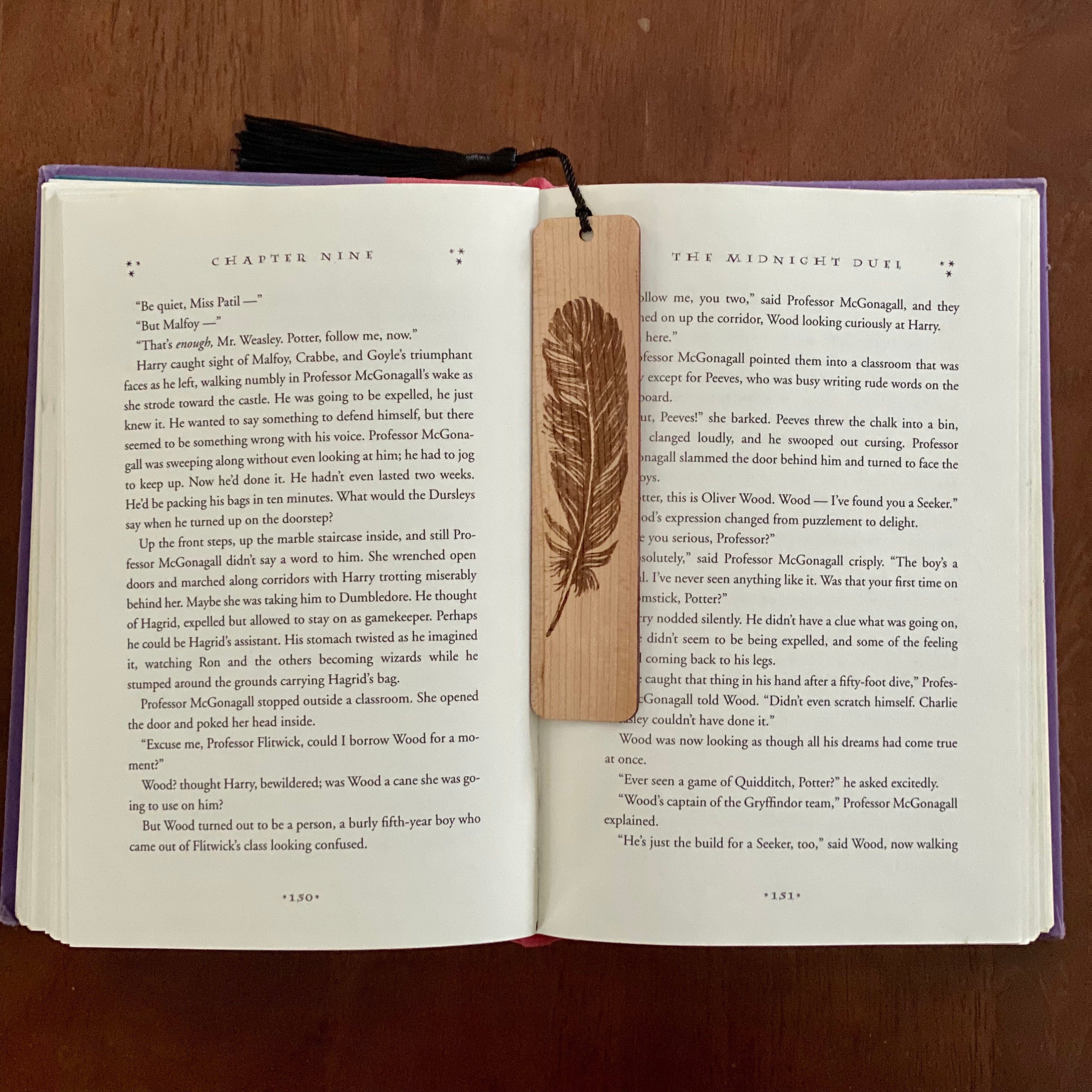 Feather Engraved Wood Bookmark made of Cherry hardwood with a detailed feather illustration and colorful terylene tassel.