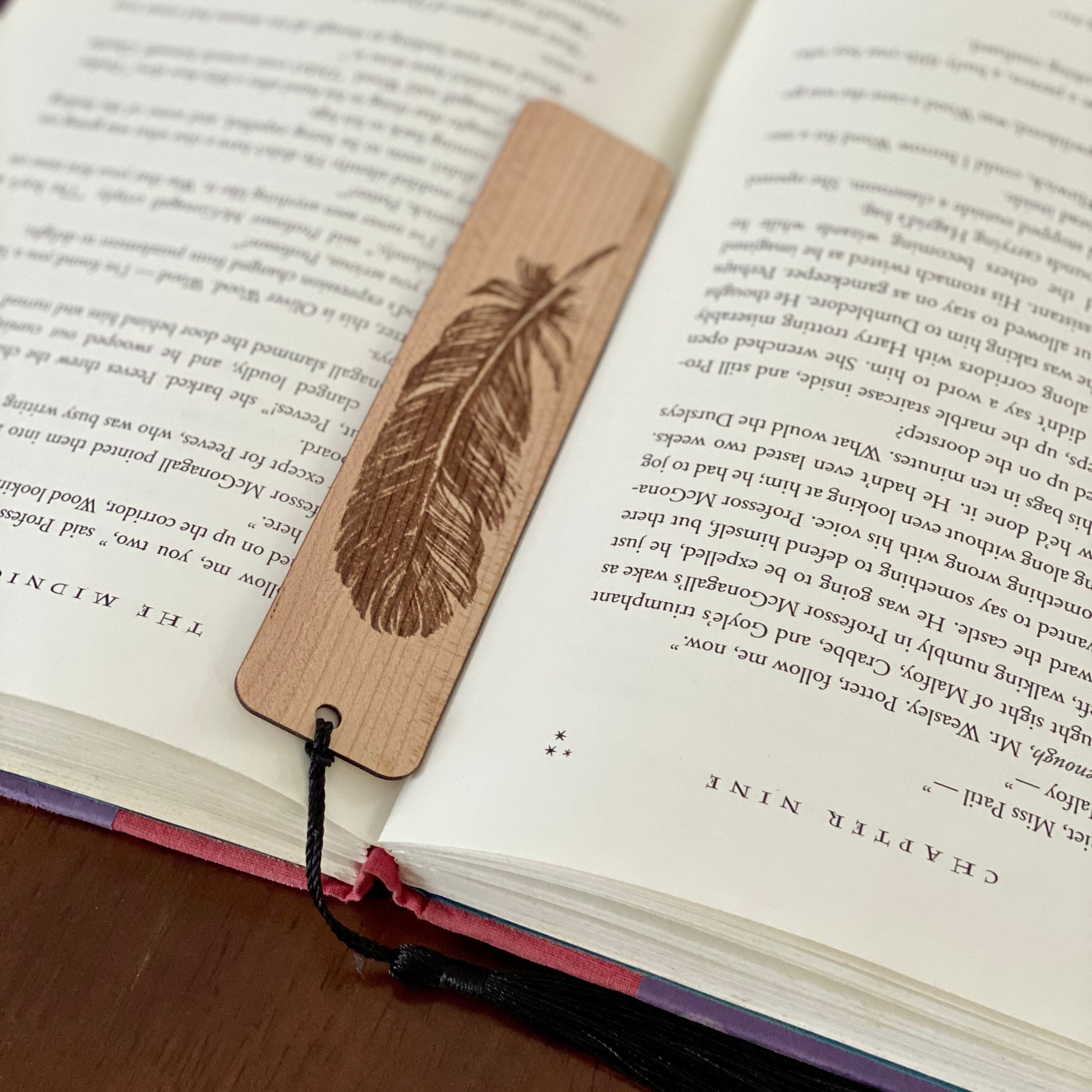 Feather Engraved Wood Bookmark made of Cherry hardwood with a detailed feather illustration and colorful terylene tassel.