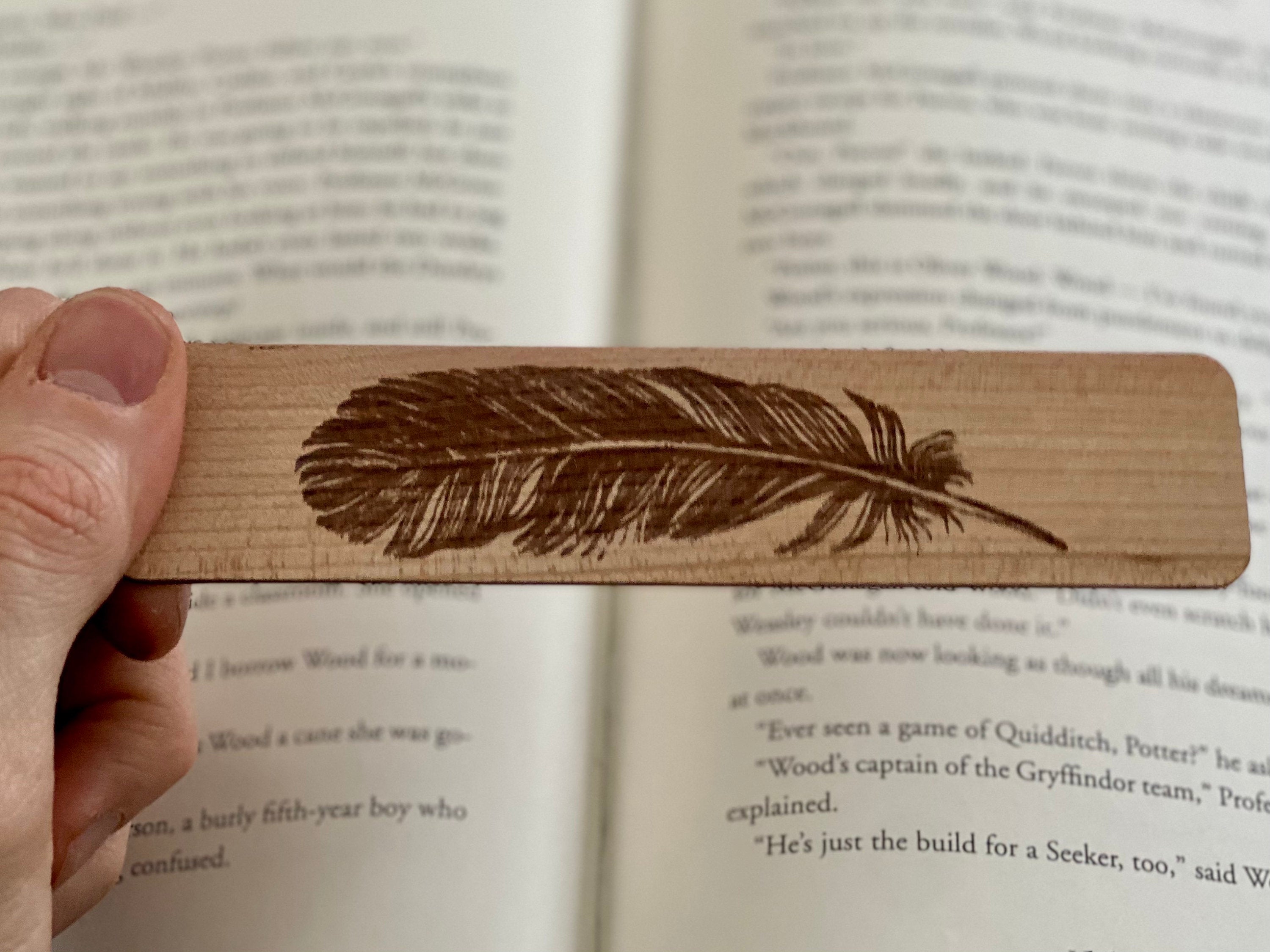 Feather Engraved Wood Bookmark made of Cherry hardwood with a detailed feather illustration and colorful terylene tassel.