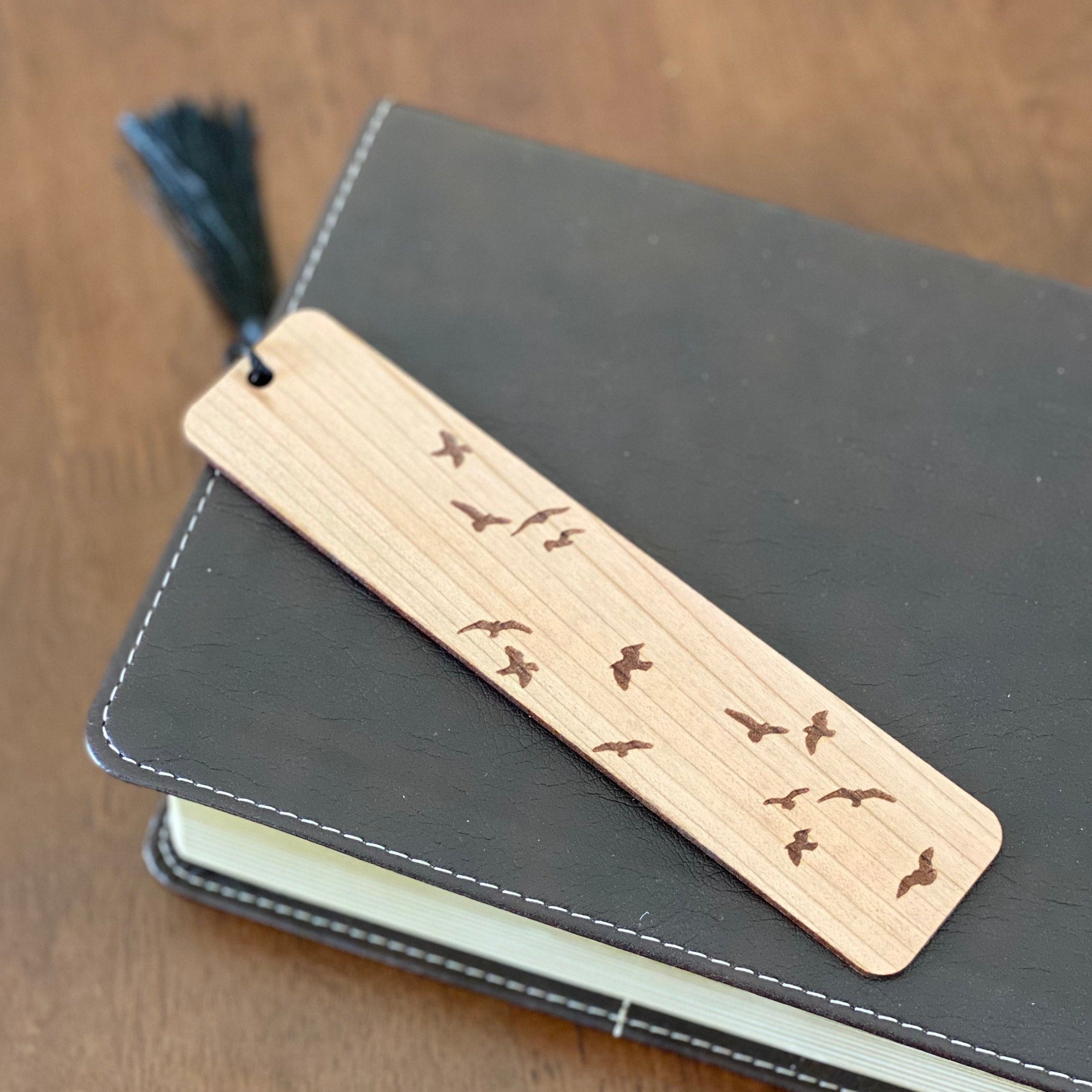 Elegant Flying Birds Engraved Wood Bookmark made of cherry hardwood with bird silhouettes and a colorful tassel.