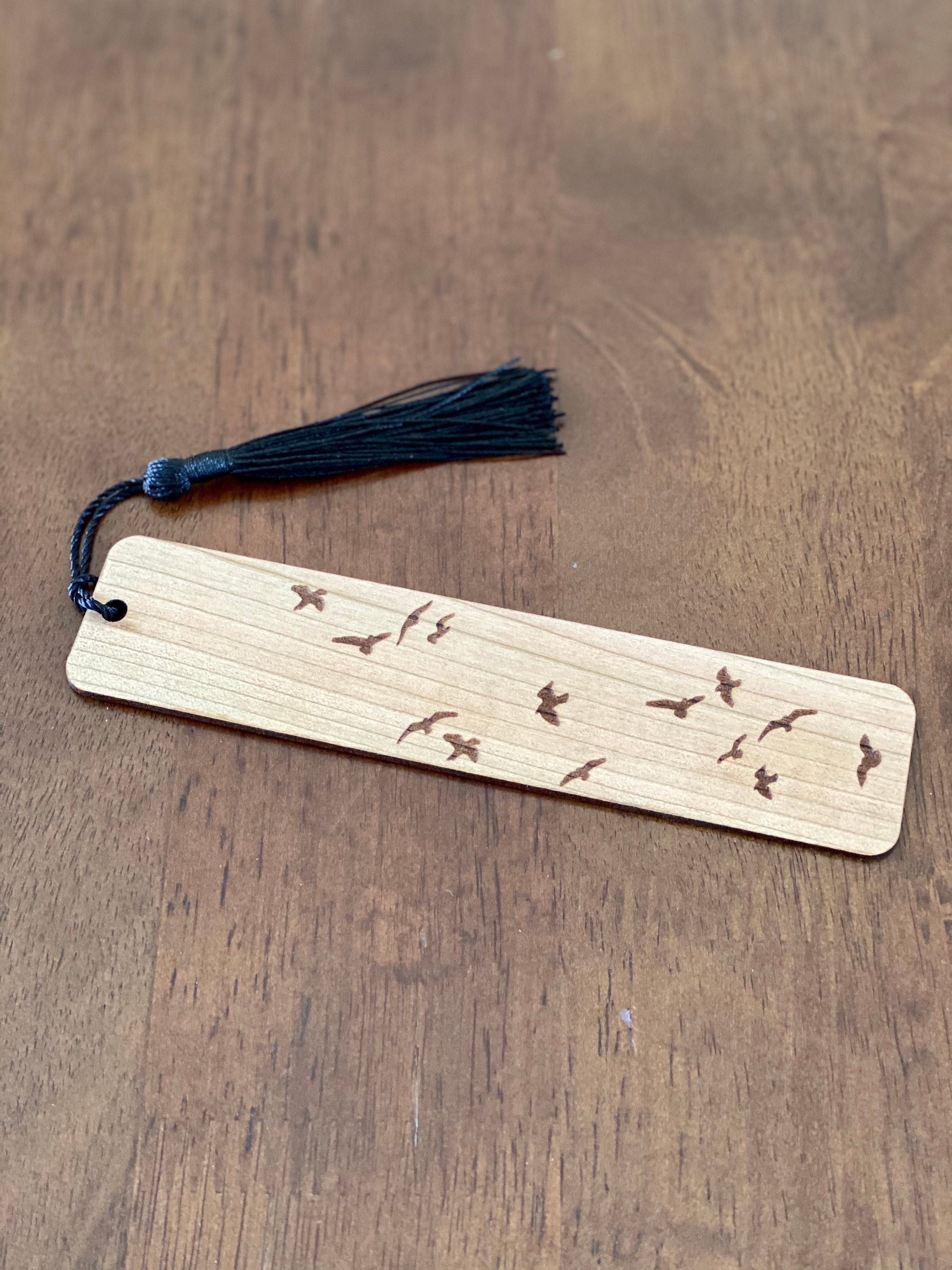 Elegant Flying Birds Engraved Wood Bookmark made of cherry hardwood with bird silhouettes and a colorful tassel.