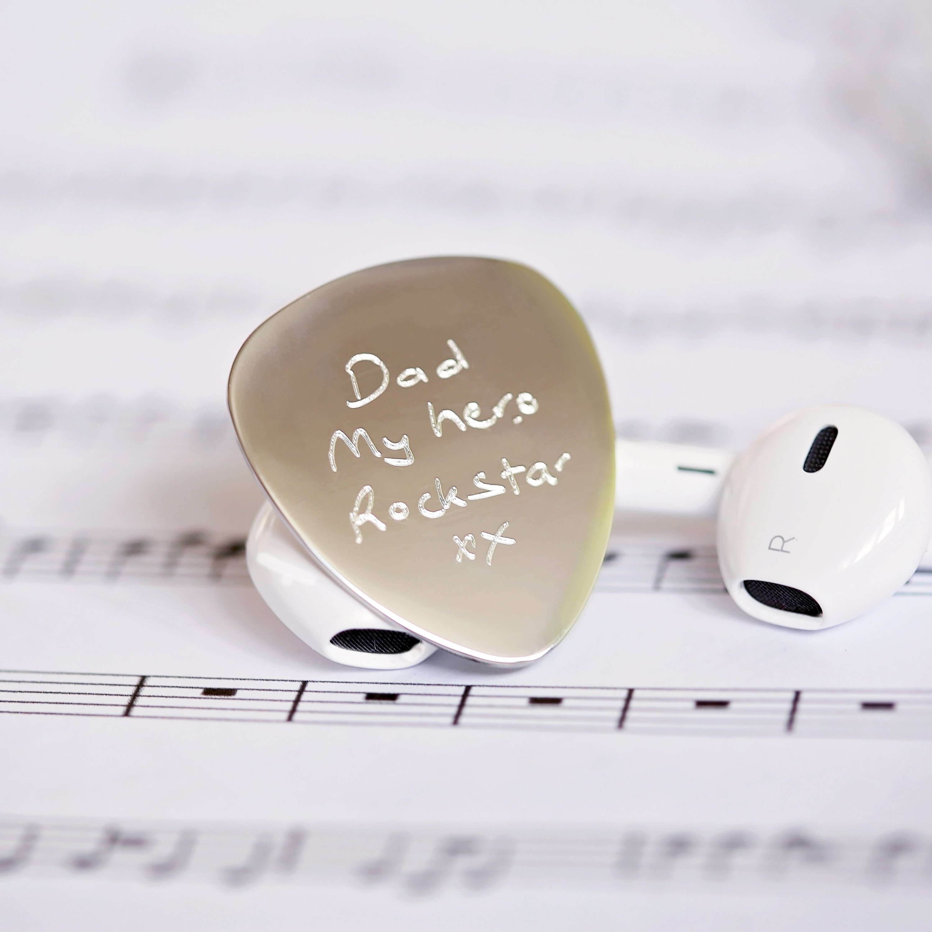 Personalised Handwriting Engraving Guitar Pick in a gift box with satin ribbon and blue zig-zag shred.