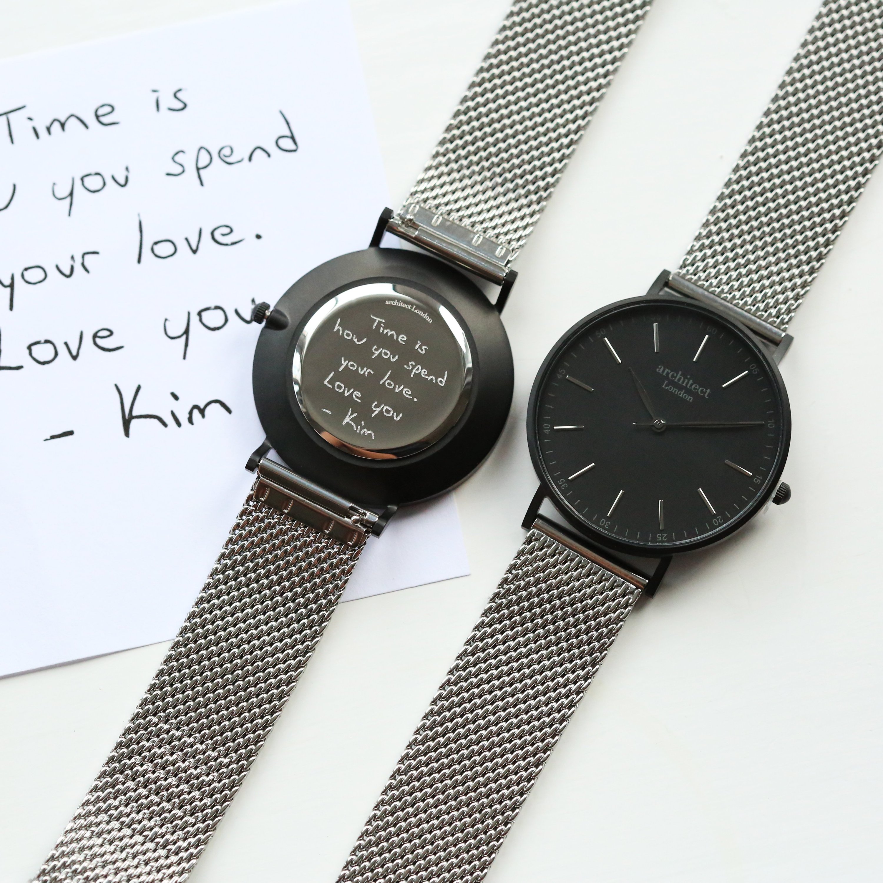 Men's minimalist watch with steel silver mesh strap and personalized handwriting engraving on the back.