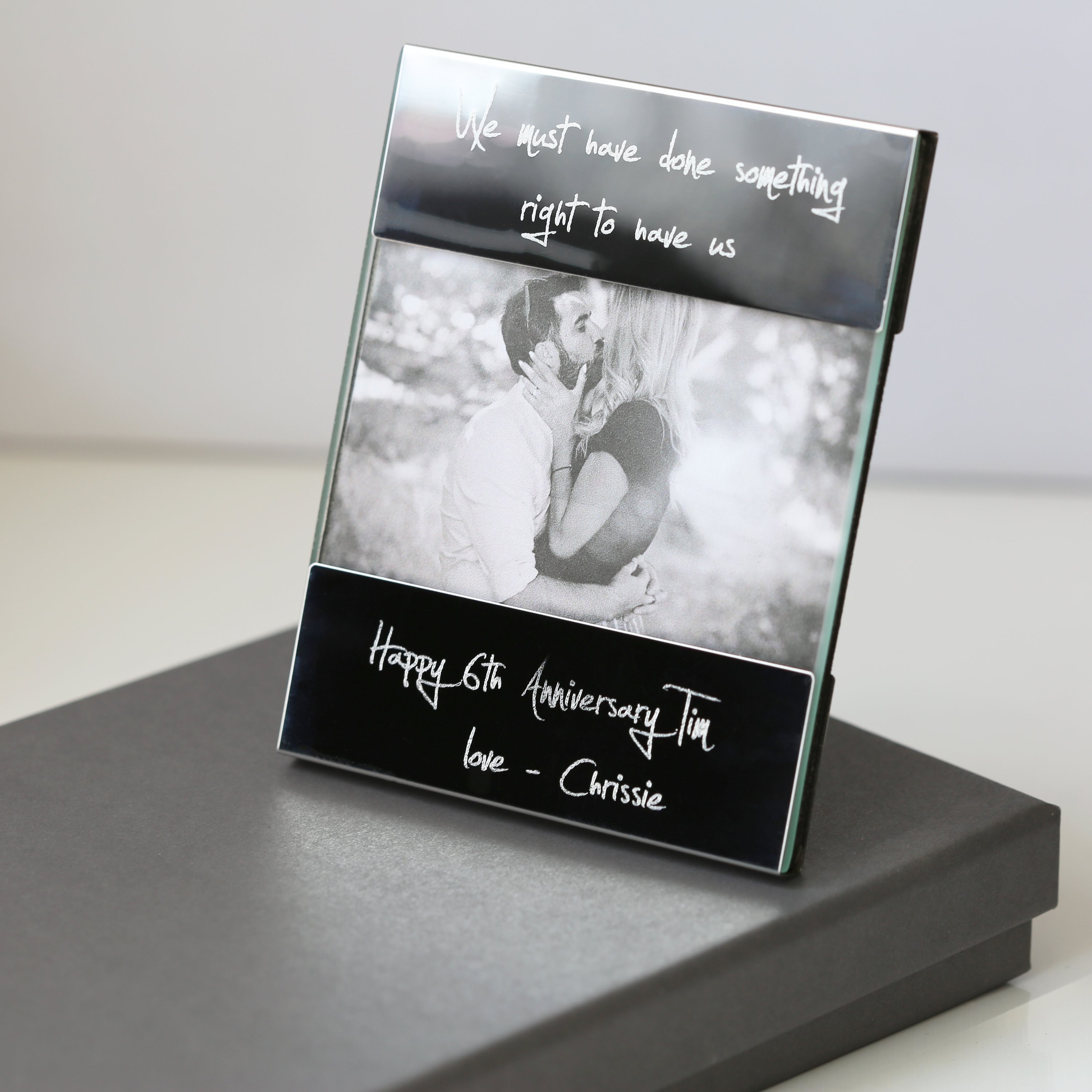 A modern Handwriting Engraving Photo Frame made of polished stainless steel, showcasing a personalized engraving with handwritten message.