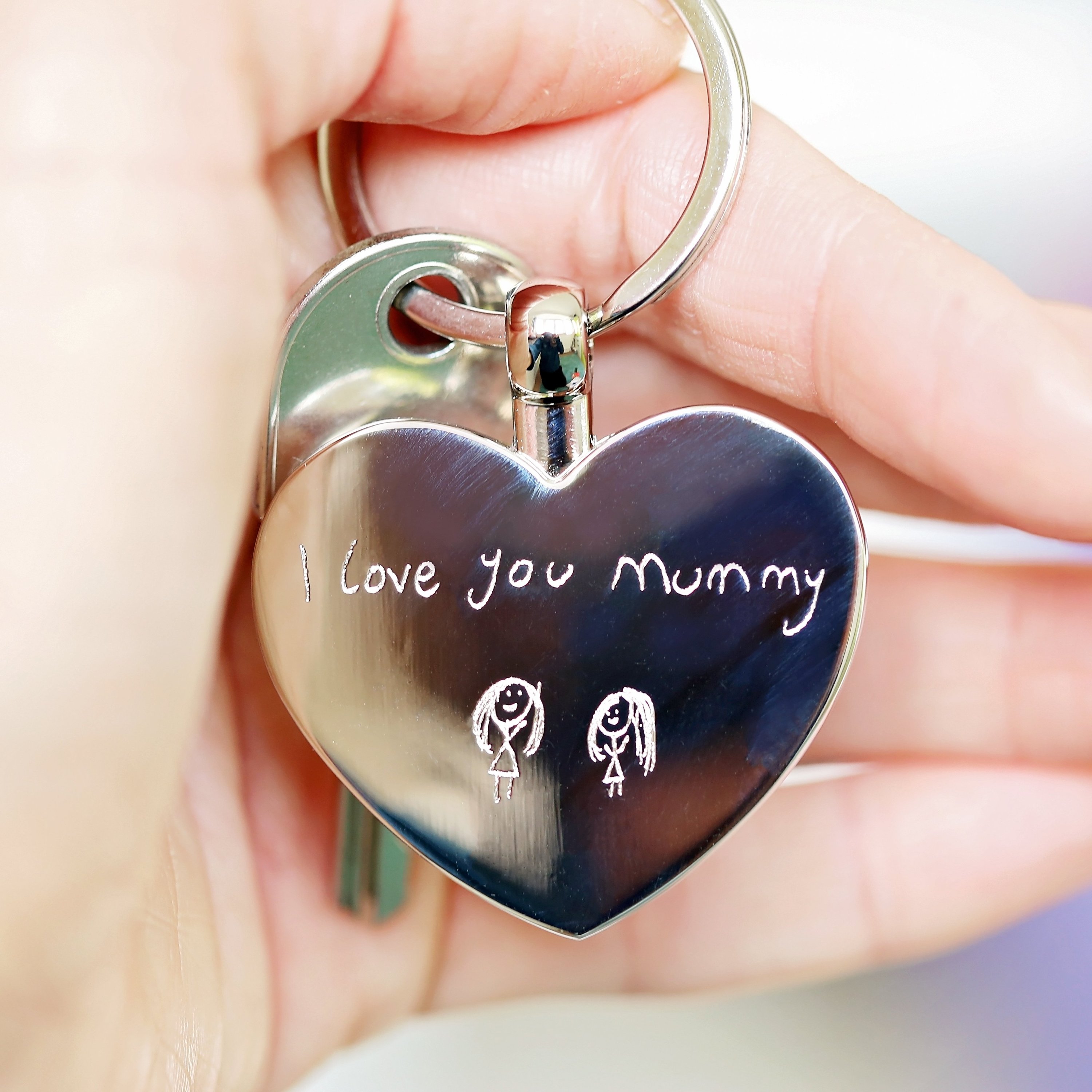 Hearts Forever keychain featuring personalized handwriting engraving, presented in a stylish gift box with blue zig-zag shred.