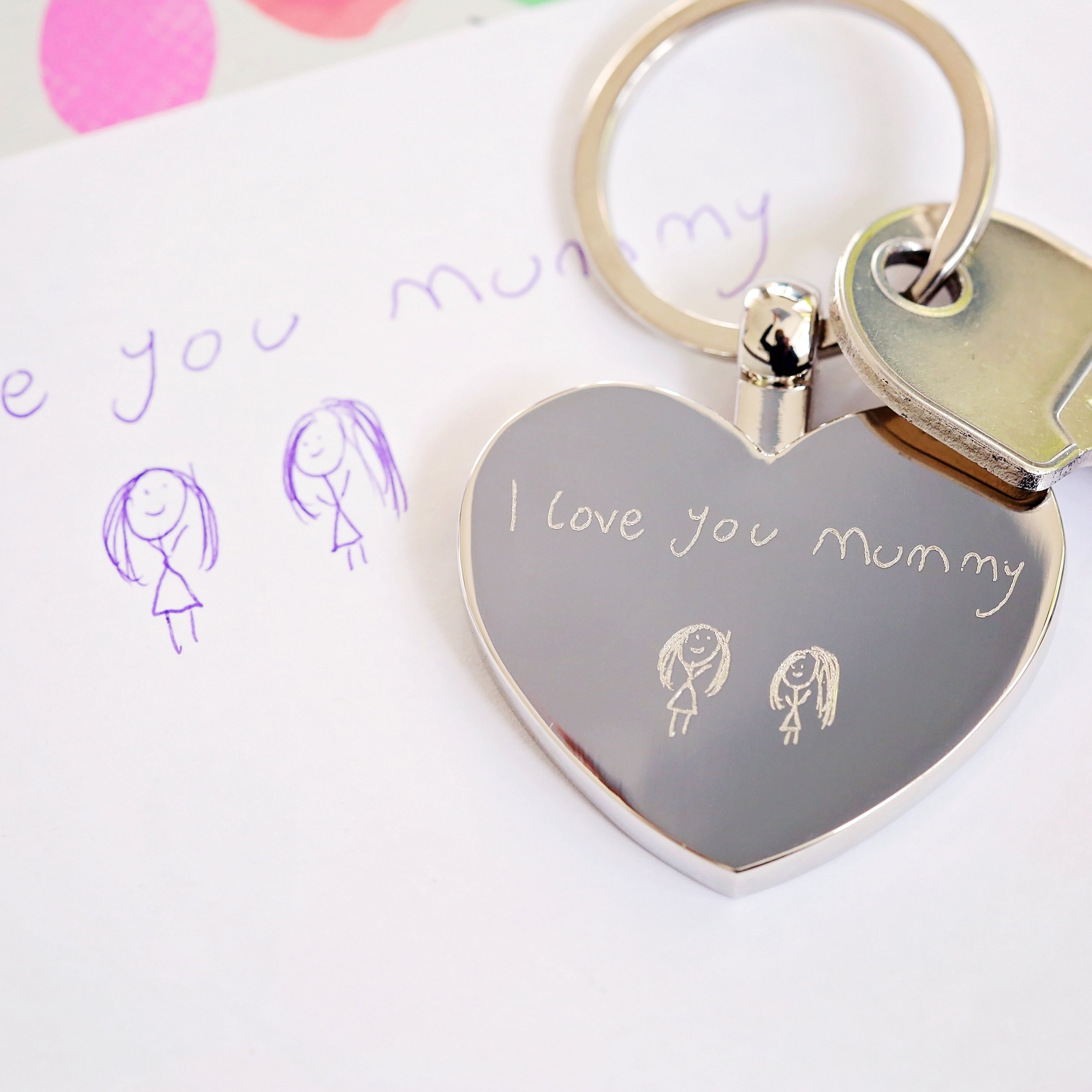 Hearts Forever keychain featuring personalized handwriting engraving, presented in a stylish gift box with blue zig-zag shred.