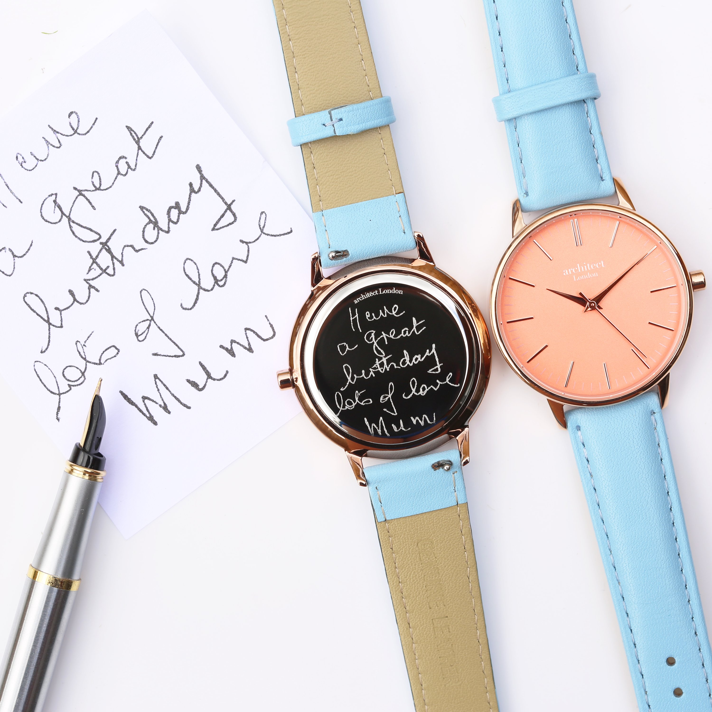 Ladies Architēct Coral watch featuring handwriting engraving and a light blue genuine leather strap, showcasing a stylish apricot coral dial.