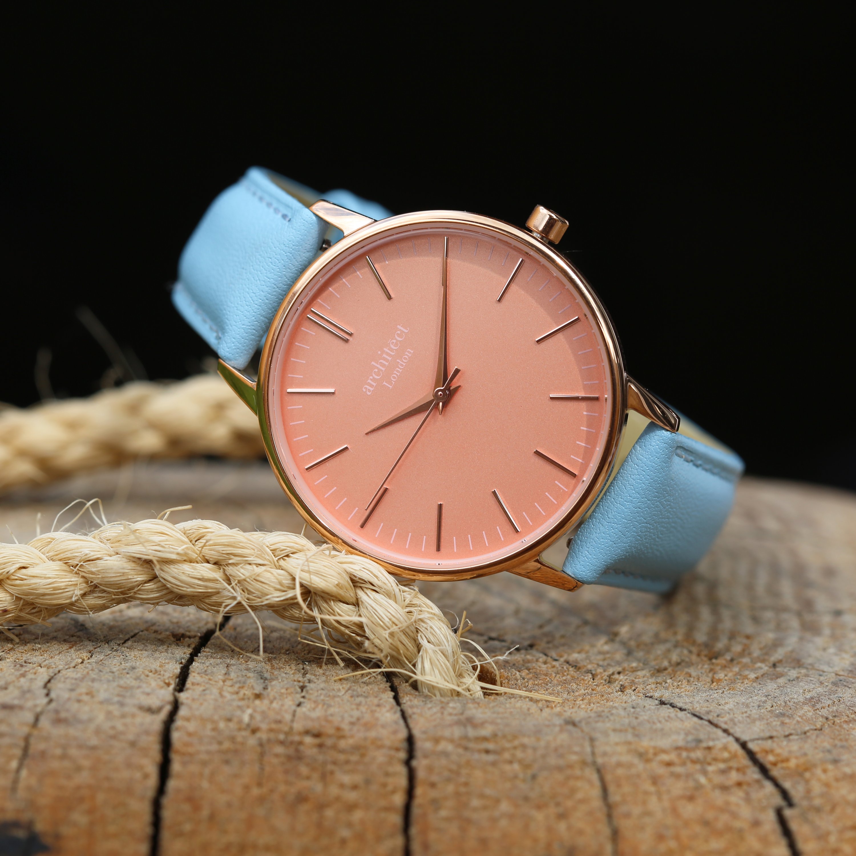 Ladies Architēct Coral watch featuring handwriting engraving and a light blue genuine leather strap, showcasing a stylish apricot coral dial.