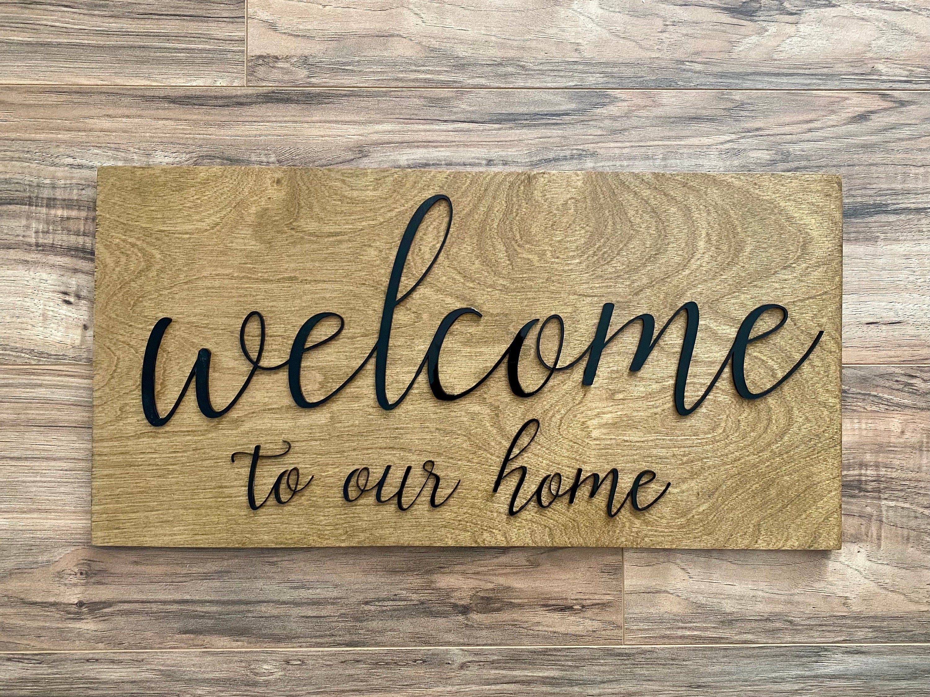 Laser Cut Wooden Welcome Sign made of birch plywood with white and black acrylic lettering, showcasing a stylish design for home decor.