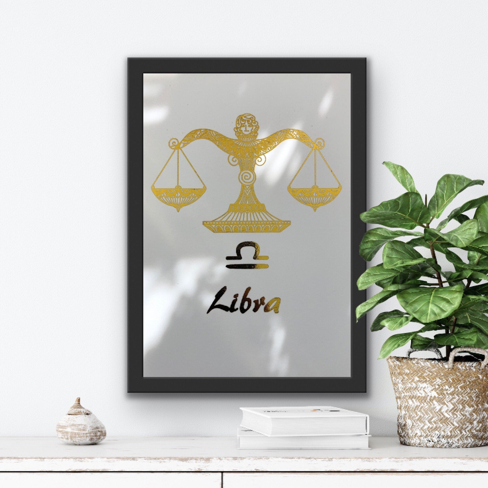 A beautiful Libra Star Sign Foil Print featuring elegant scales design, symbolizing balance and harmony, perfect for home decor.